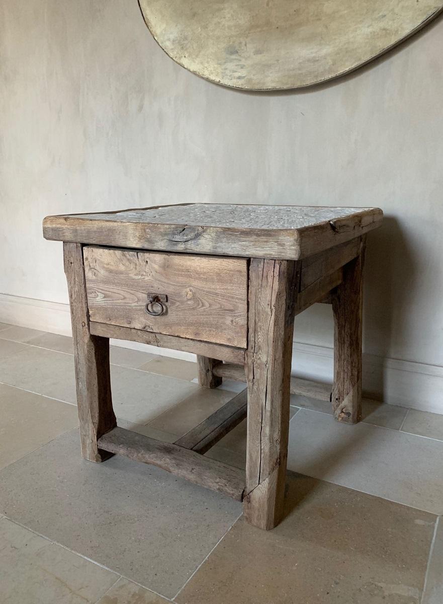 A 19th century French side/ console table from oak with a one piece sandstone top.