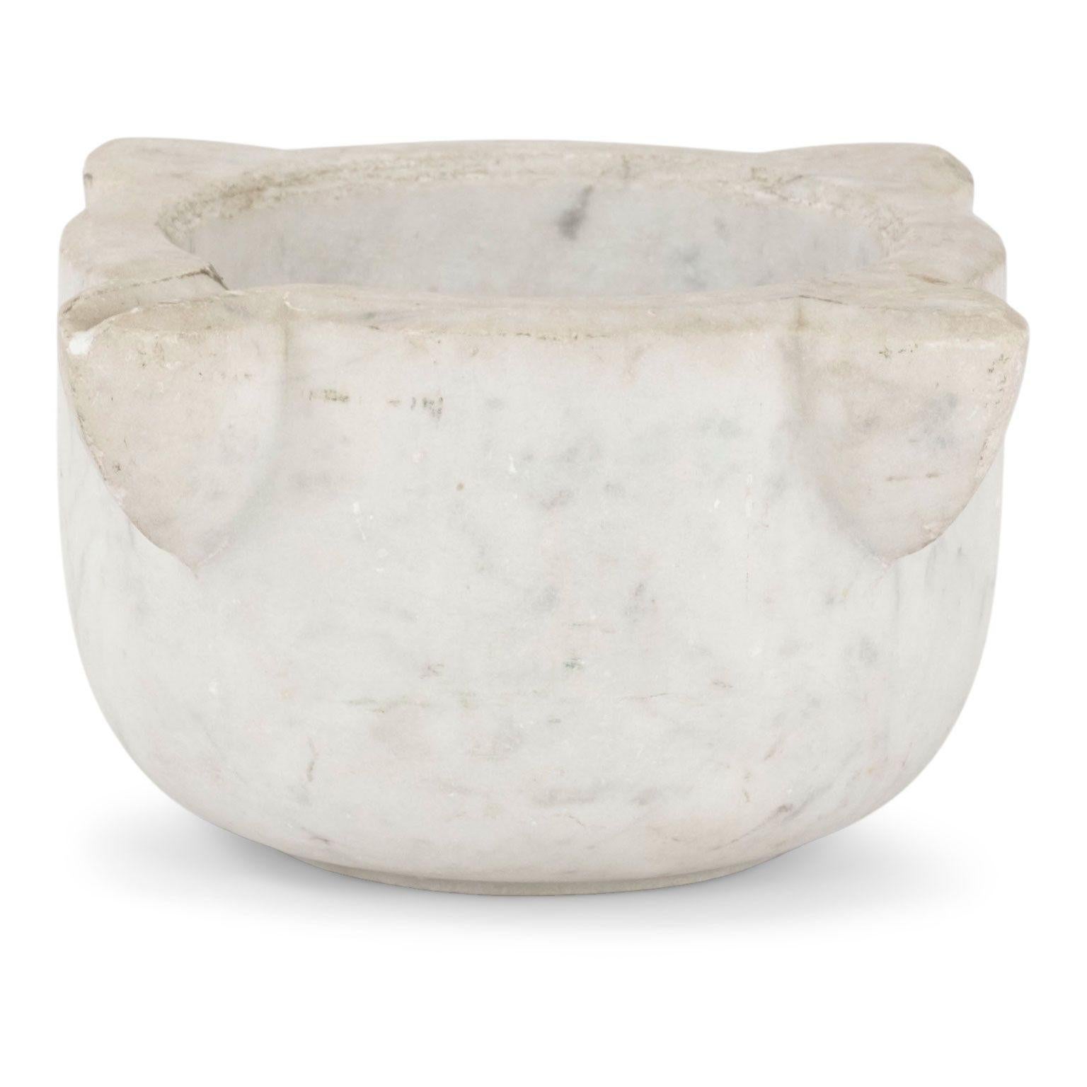 19th century stone mortar from Italy. Hand-carved marble mortar in a conical shape with four handles. One handle notched with a channel for pouring. Beautiful as a sculptural accent piece or decorative bowl. Seven stone mortars of varying shapes and