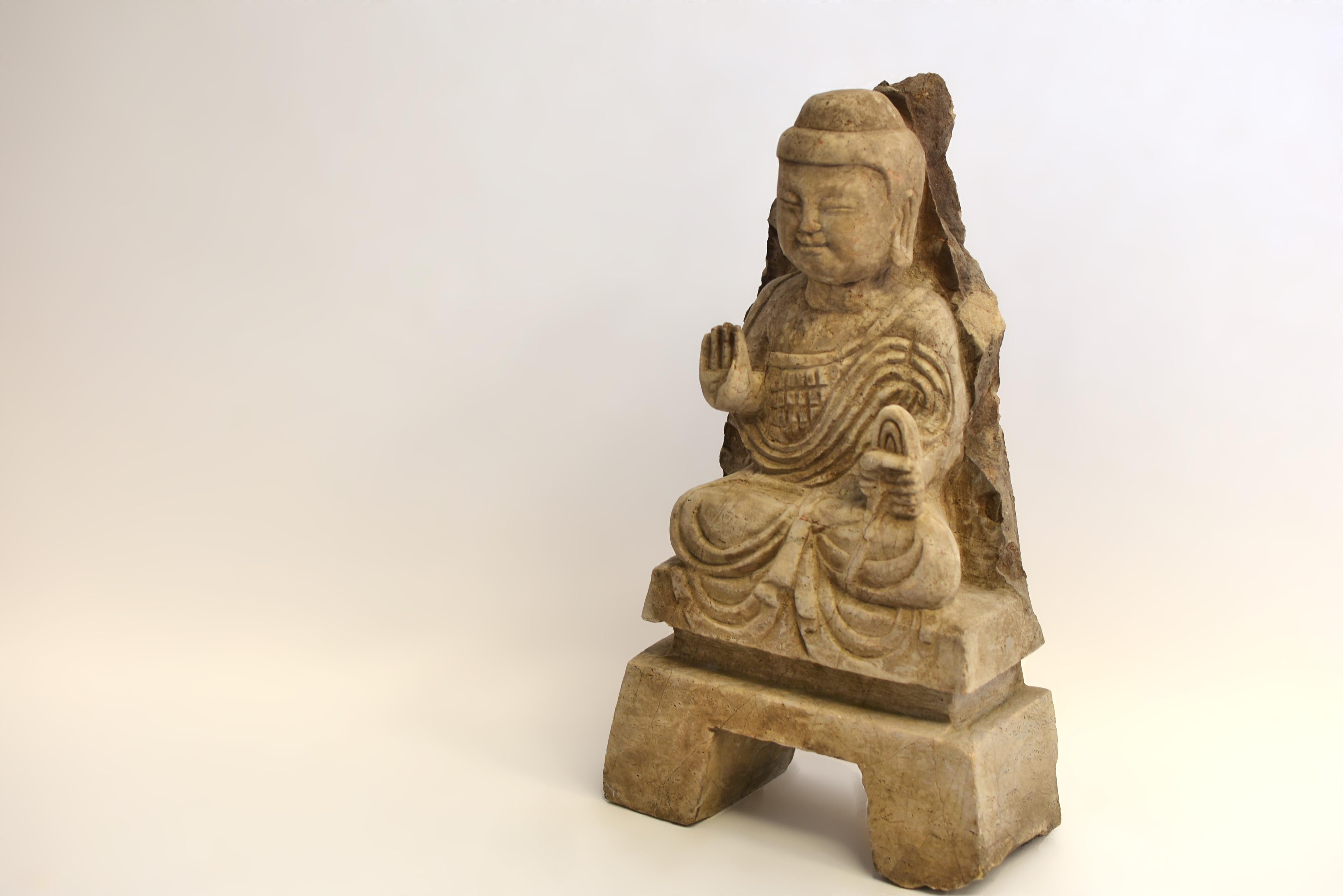 A 19th century antique stone Buddha, weighing 23 lb, depicting a young Shakyamuni. His full, rounded face—typical of the Tang Dynasty style—bears downcast eyes beneath high-arched brows, flanked by elongated pendulous earlobes. The hair is neatly