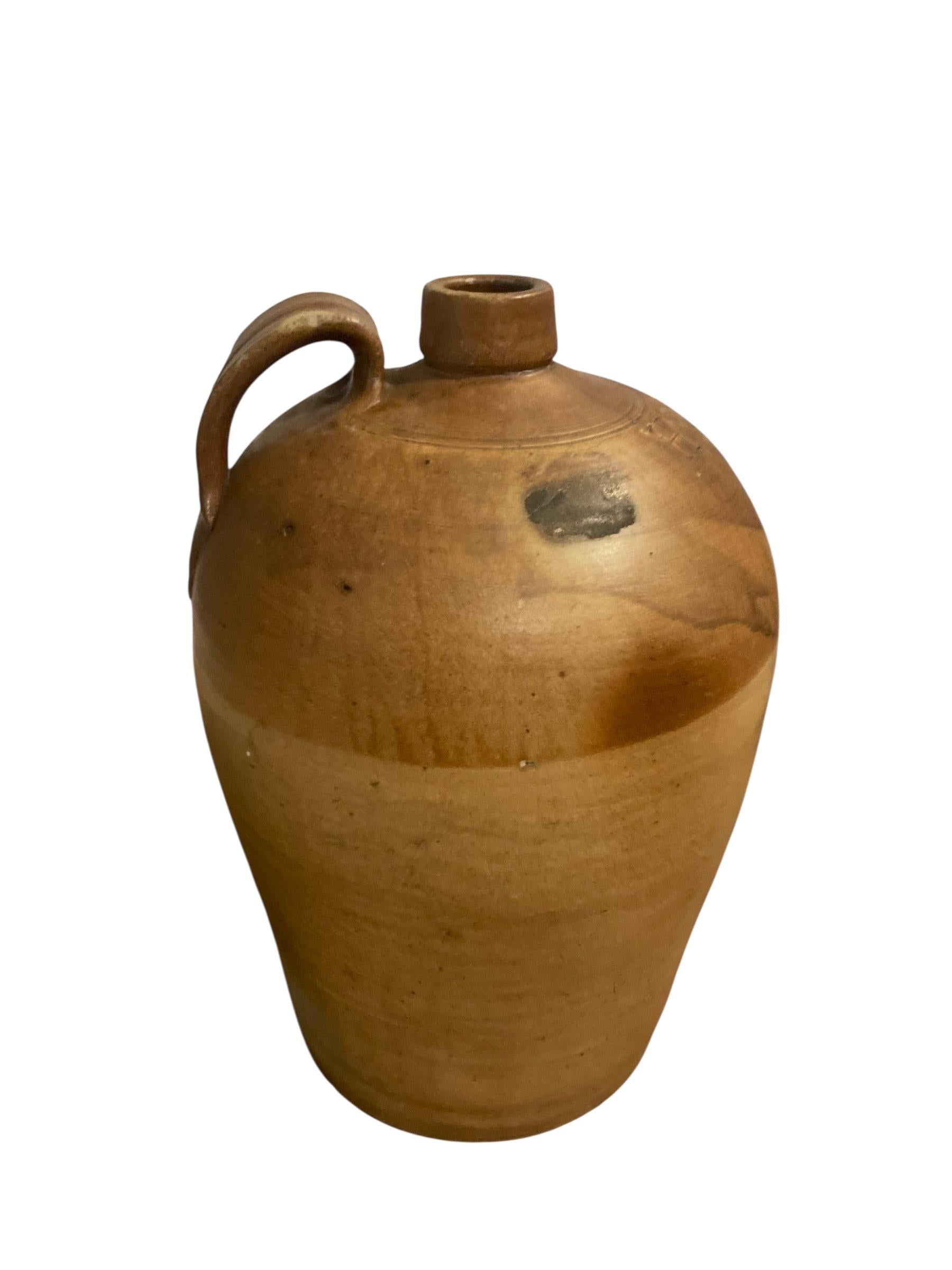 19th century stoneware salt glazed flagons. Its unique design make it an eye-catching centerpiece for your living room, dining area, or office. Ideal for displaying fresh flowers or as a standalone decorative piece, this versatile vase seamlessly