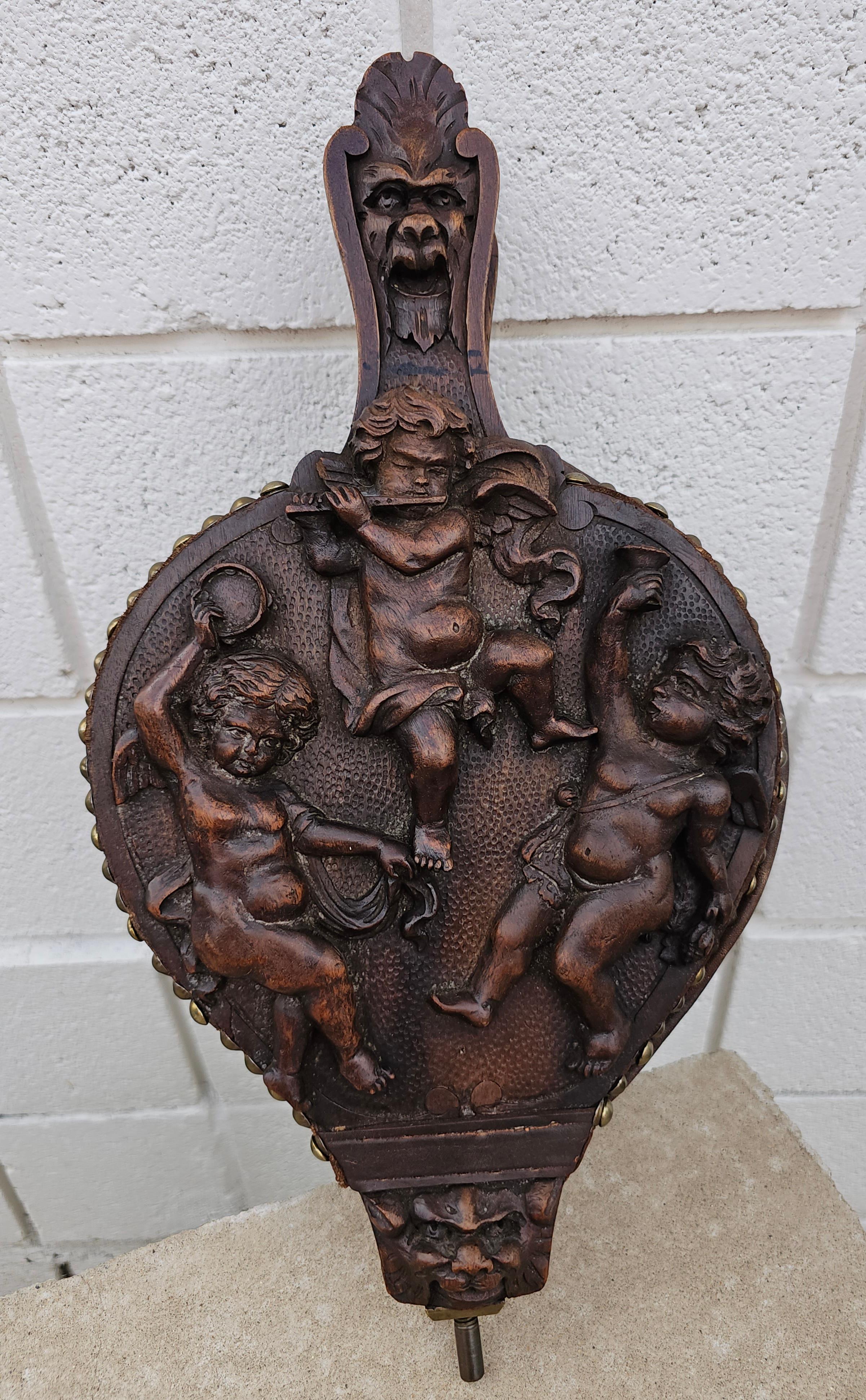 19th Century Studded Hand Carved Walnut Cherubs Bellows, L Latter In Good Condition For Sale In Germantown, MD
