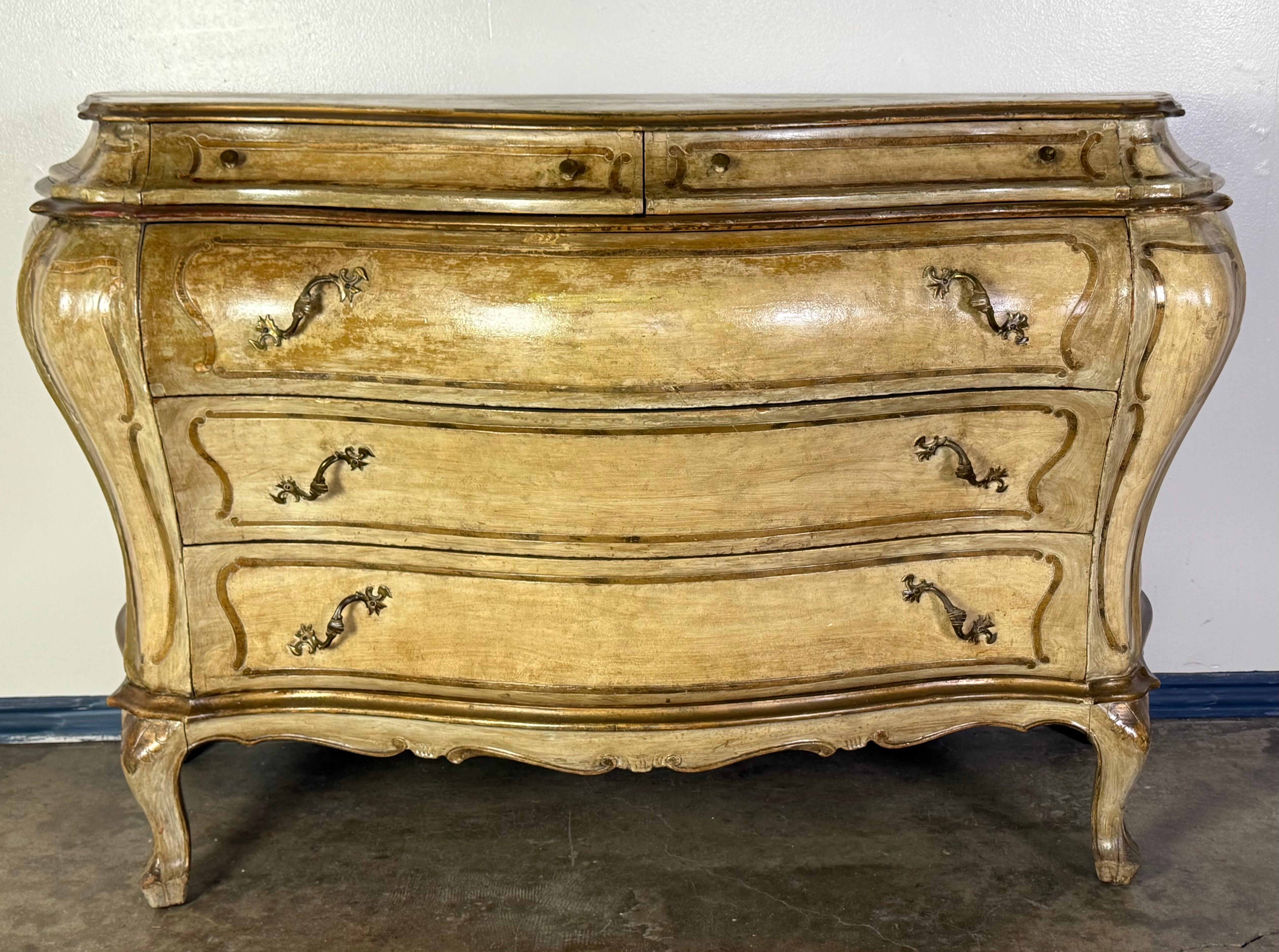 18th Century Style French Louis XV Bombé Commode in Painted Finish

A beautifully contoured French Louis XV-style bombé commode, likely late 19th to early 20th century, with a warm, time-softened painted finish.

The chest features the