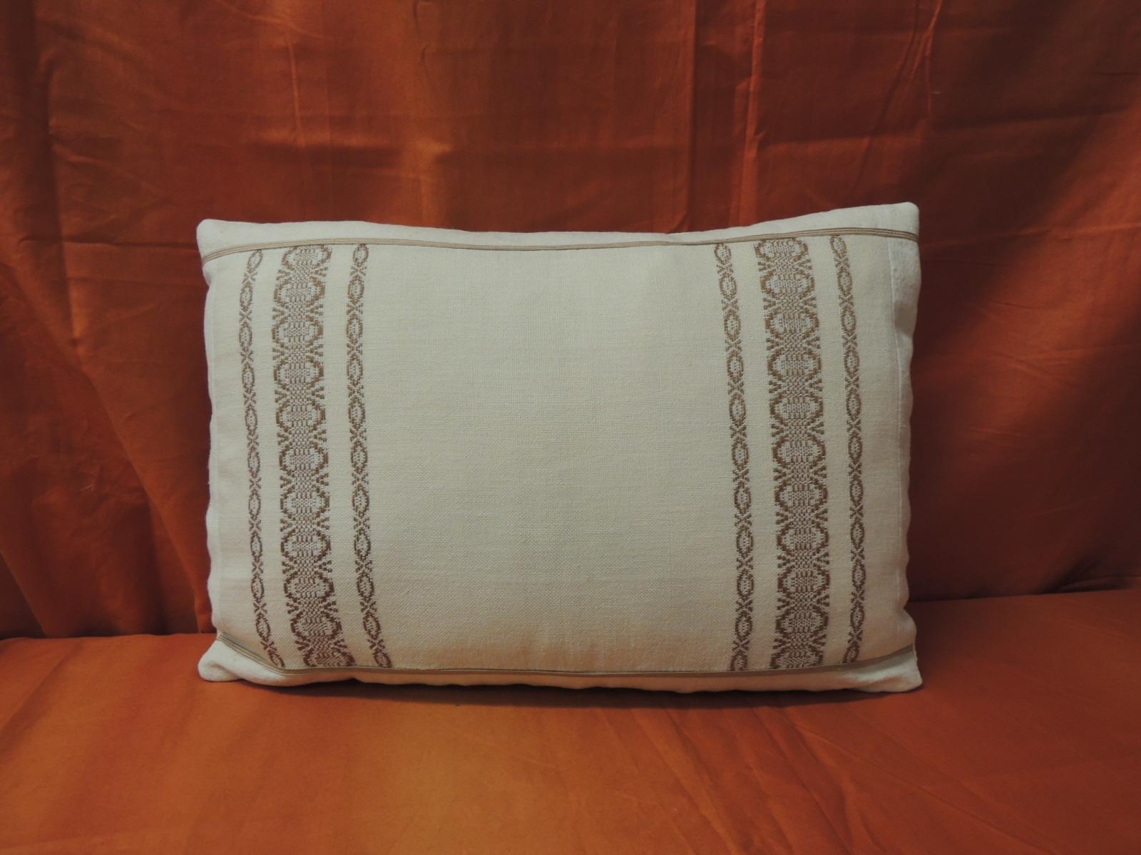 19th century style Petite Greek isle embroidery decorative lumbar pillow with silk embellished flat trim at the seams, 
framed and backed with natural homespun linen. In shades of tan, natural, brown. 
Handcrafted and designed in the USA with a