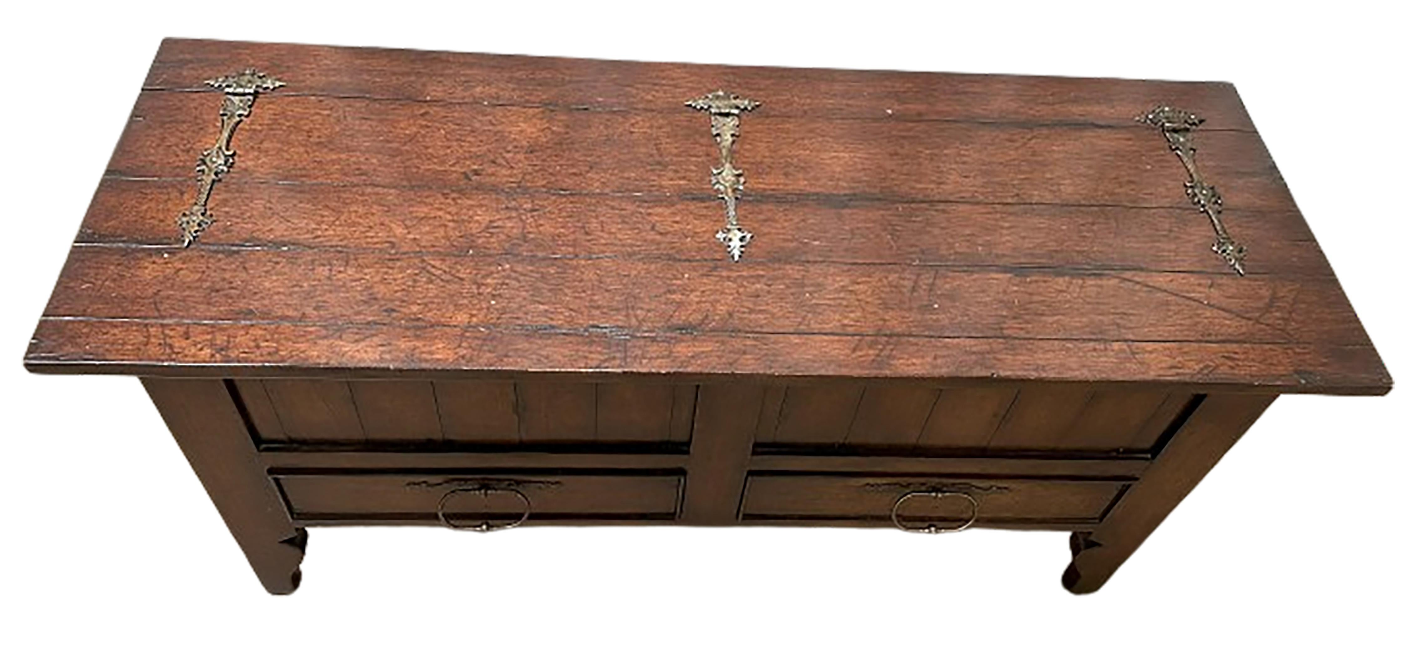 A handsome 19th century style walnut chest. Top opens up. Three brass hinges on the top. Brass handles included on lower drawers as well. 

In very good condition. Some gentle wear consistent with age and use.

No obvious markings on the piece.