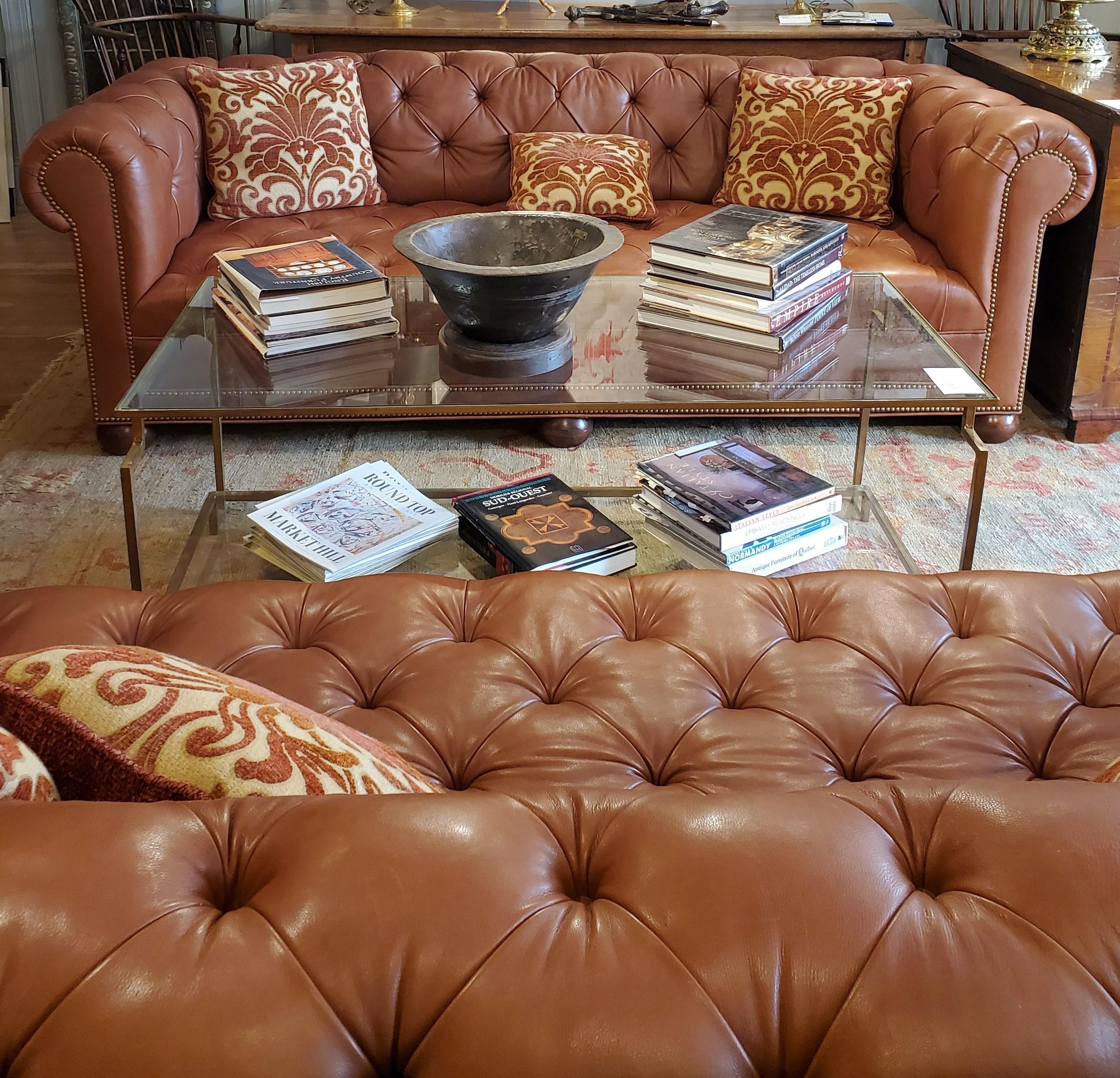 Leather Chesterfield in the style of 19th century English design. Soft buttery leather tufted with nailhead decoration beautiful proportions and remarkably comfortable. Beautifully sophisticated addition to an office, library or study. Fabricated by