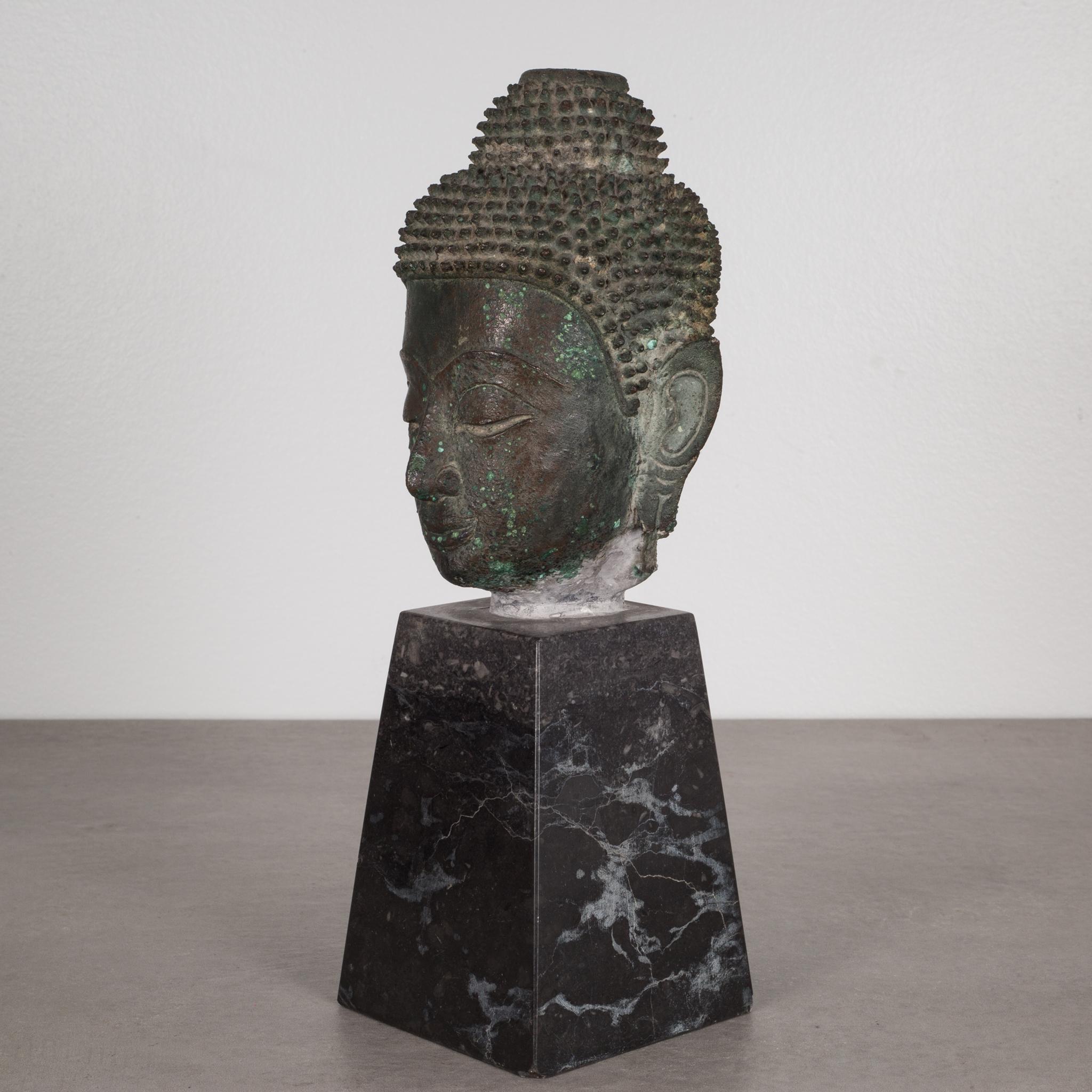 About

This is an original lost-wax casting bronze head of Buddah Shakyamuni from the 19th century, Thailand. It is mounted on a contemporary marble base. His meditative expression, arched eyebrows, downcast eyes, smiling lips, elongated earlobes