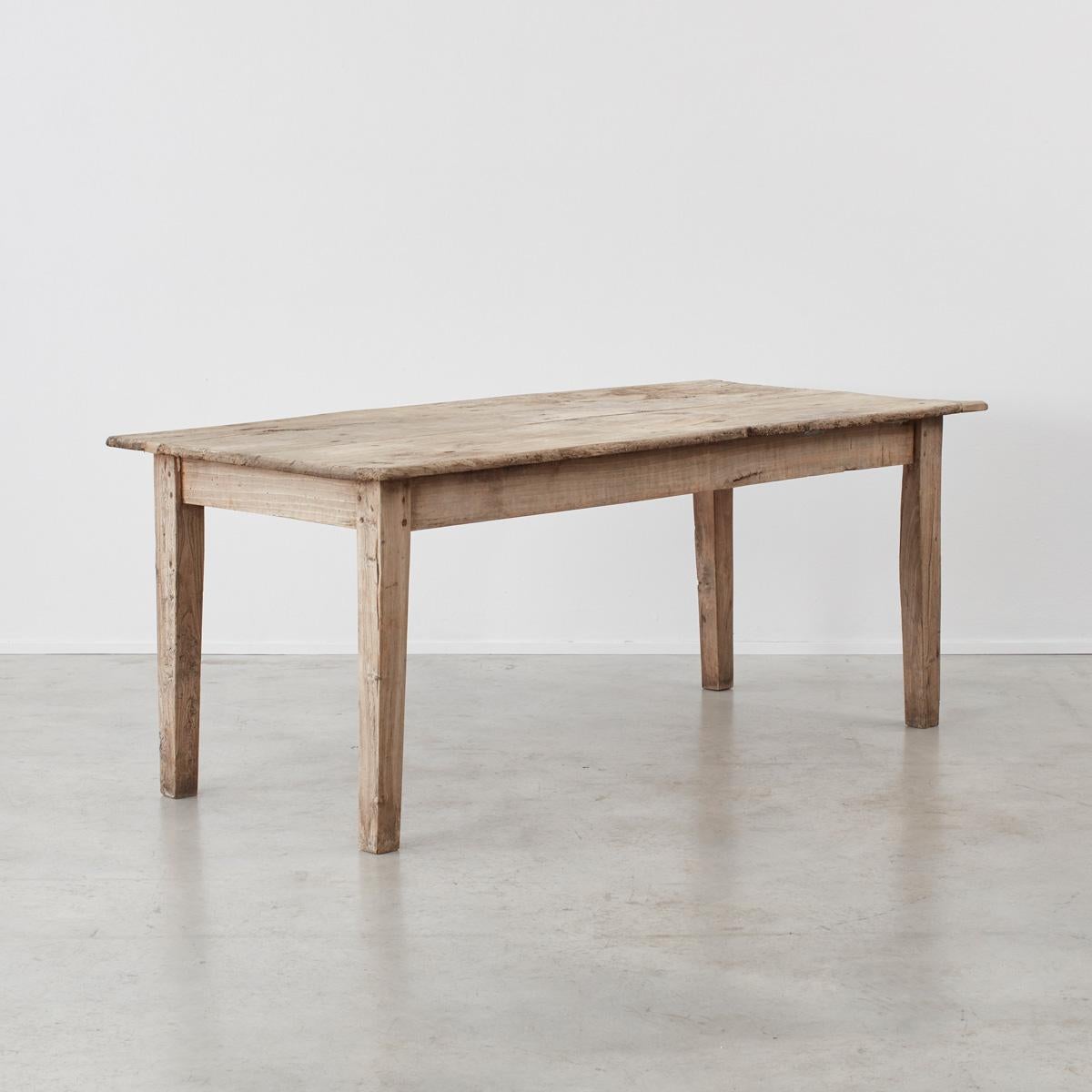 This sun-bleached, open-grained dining table will easily sit six guests - or at a squeeze, eight. It has a heavily patinated and bleached out walnut top on elm legs. It would be equally at home in a country cottage, sunny villa or antique-strewn