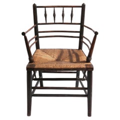 Silla "Sussex Chair" del siglo XIX, diseñada por Philip Webb para William Morris & Co.