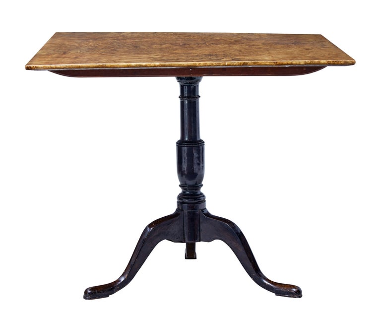 Near square Swedish table in desirable alder root, circa 1860.

Lovely color and grain which makes this stand out from its birch counterparts.

Standing on a turned ebonized base. Terminating on pad foot.

Minor polish losses to base.