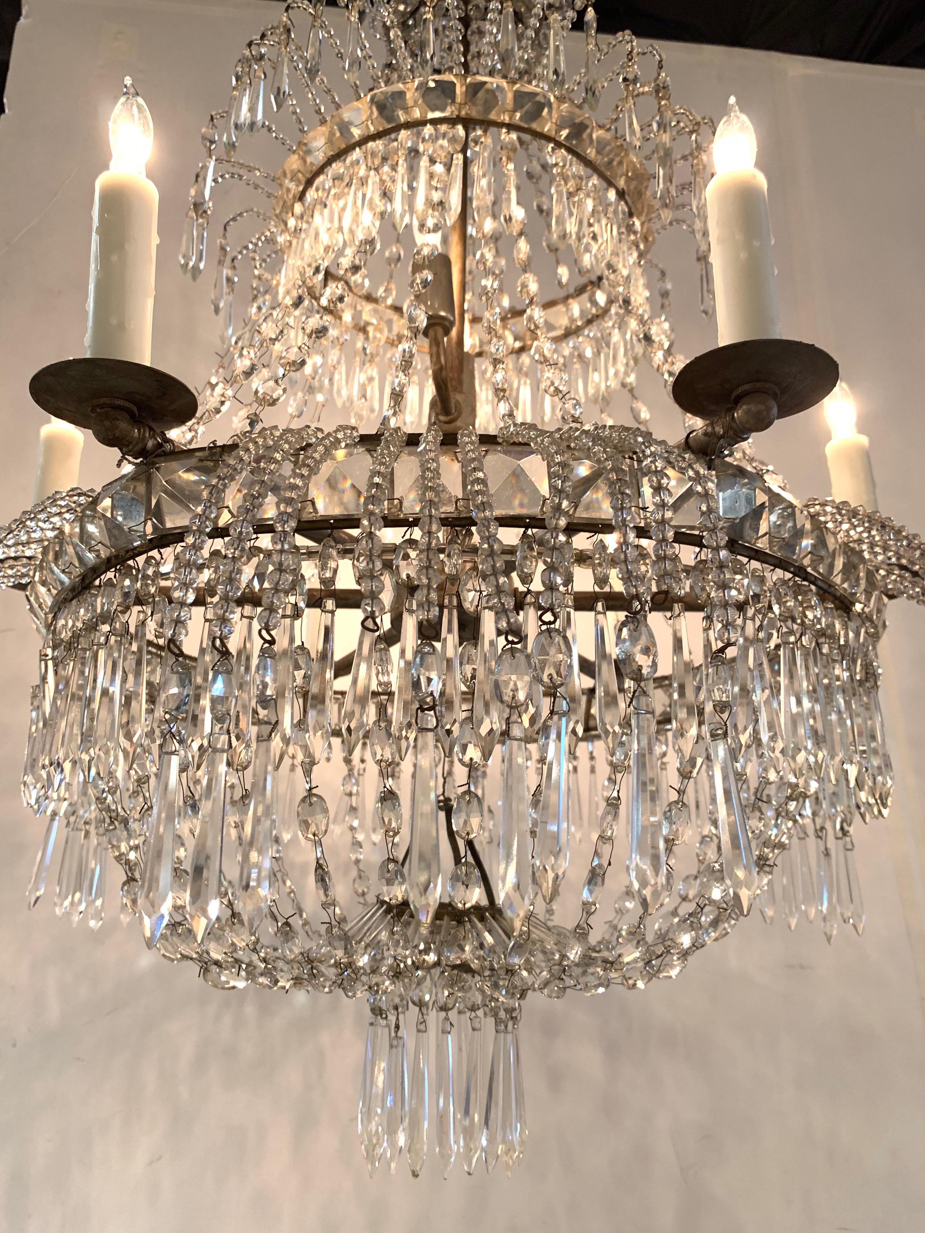 Very unique early 19th century Swedish beaded crystal chandelier. This basket form, pagoda inspired chandelier has a lovely array of beads and prisms. Makes a refined statement.