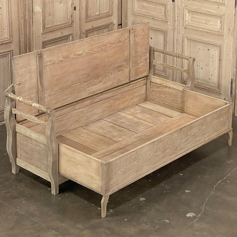 19th Century Swedish Bench ~ Trundle Bed in Stripped Pine is a classic example of the continuing traditions of craftsmanship that came to the fore during the Gustavian period.  Utilizing native old-growth pine, the artisans crafted a tailored design
