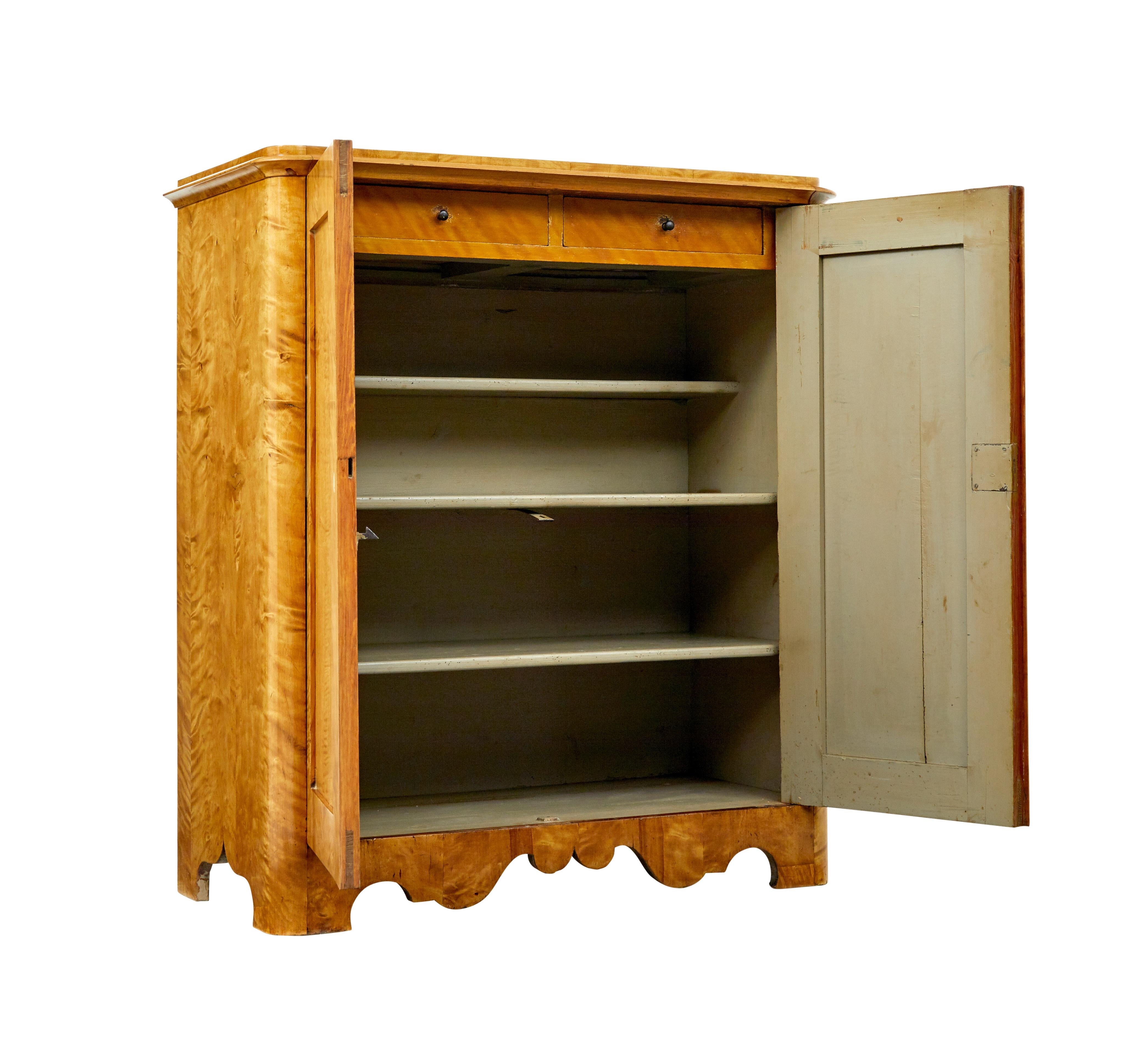 19th century Swedish birch cupboard circa 1860.

We are pleased to offer this beautifully Swedish piece of craftsmanship, making it a practical antique for everyday use.

Fantastic colour and patina, veneered allover in a tiger birch.  Rectangular
