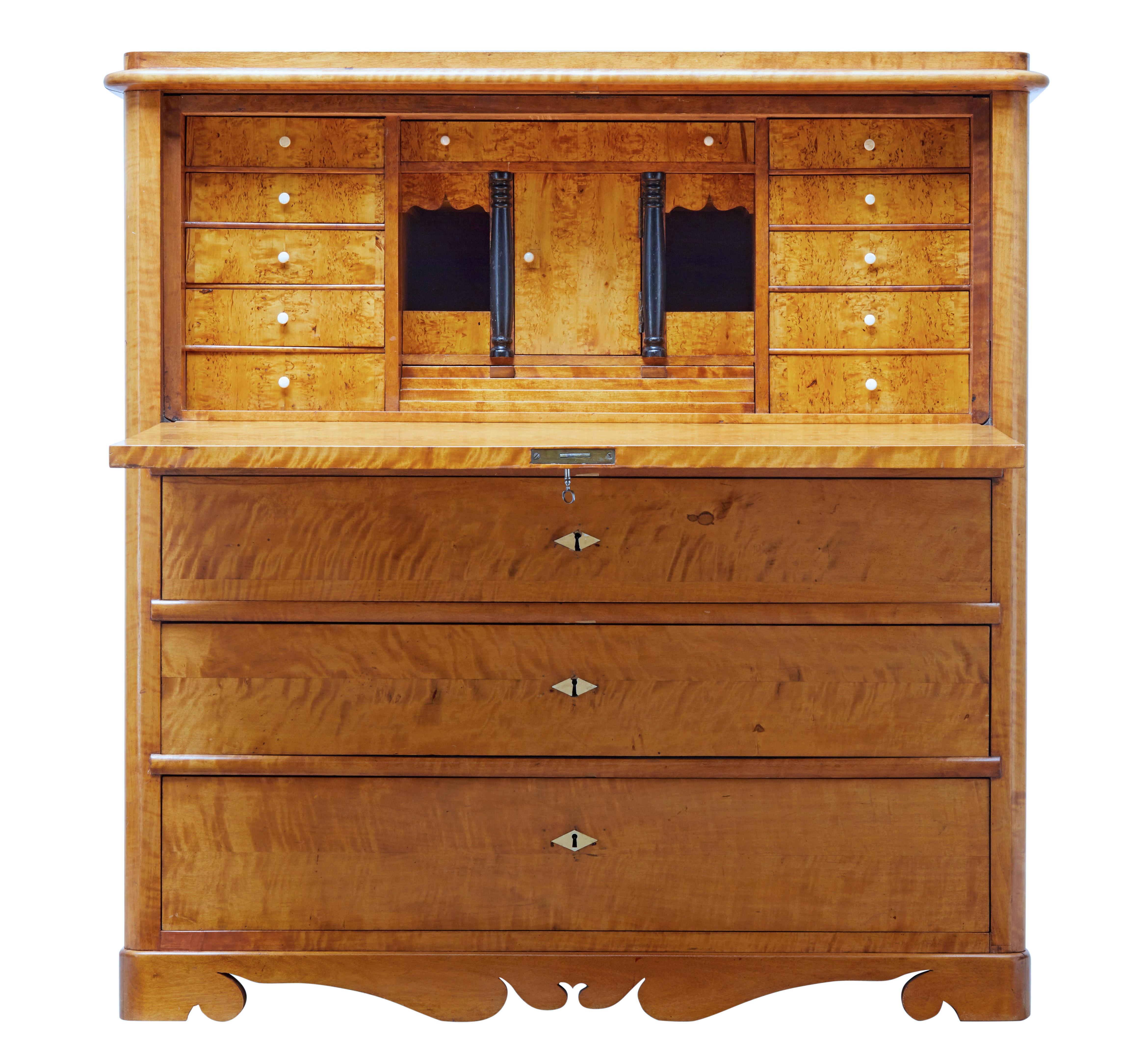 Good quality Swedish birch secretaire, circa 1870.

Fall drops down to reveal a fully fitted interior and writing surface. Interior with central tabernacle decorated with ebonized columns, drawers, pigeon holes and a step drawer below. A bank of 5