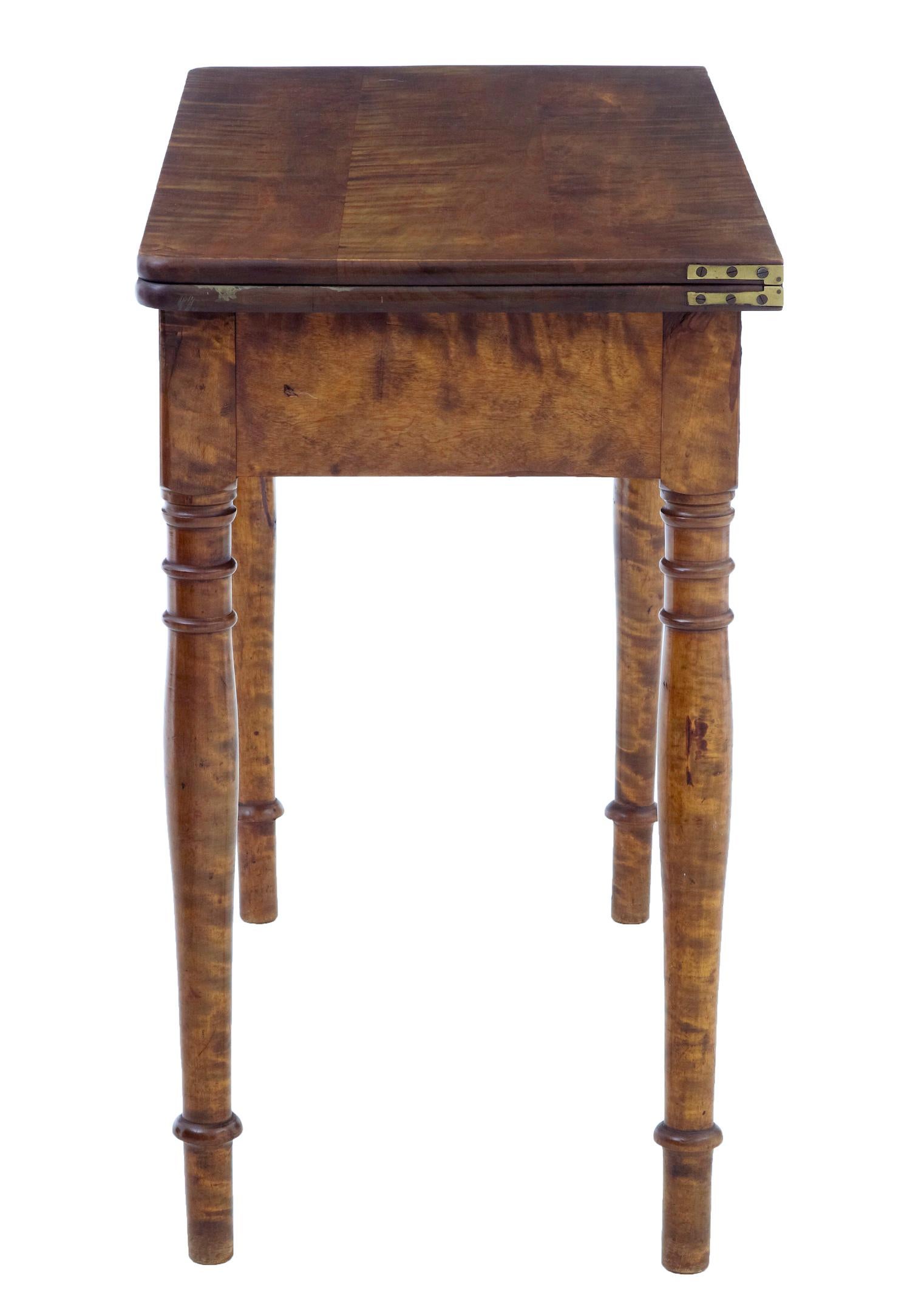 19th century Swedish birch tea table circa 1890.

Good quality stained birch table, rectangular top with rounded corners.  Twists and then flips open to form a larger table surface, with a storage well underneath.

Could function in multiple rooms