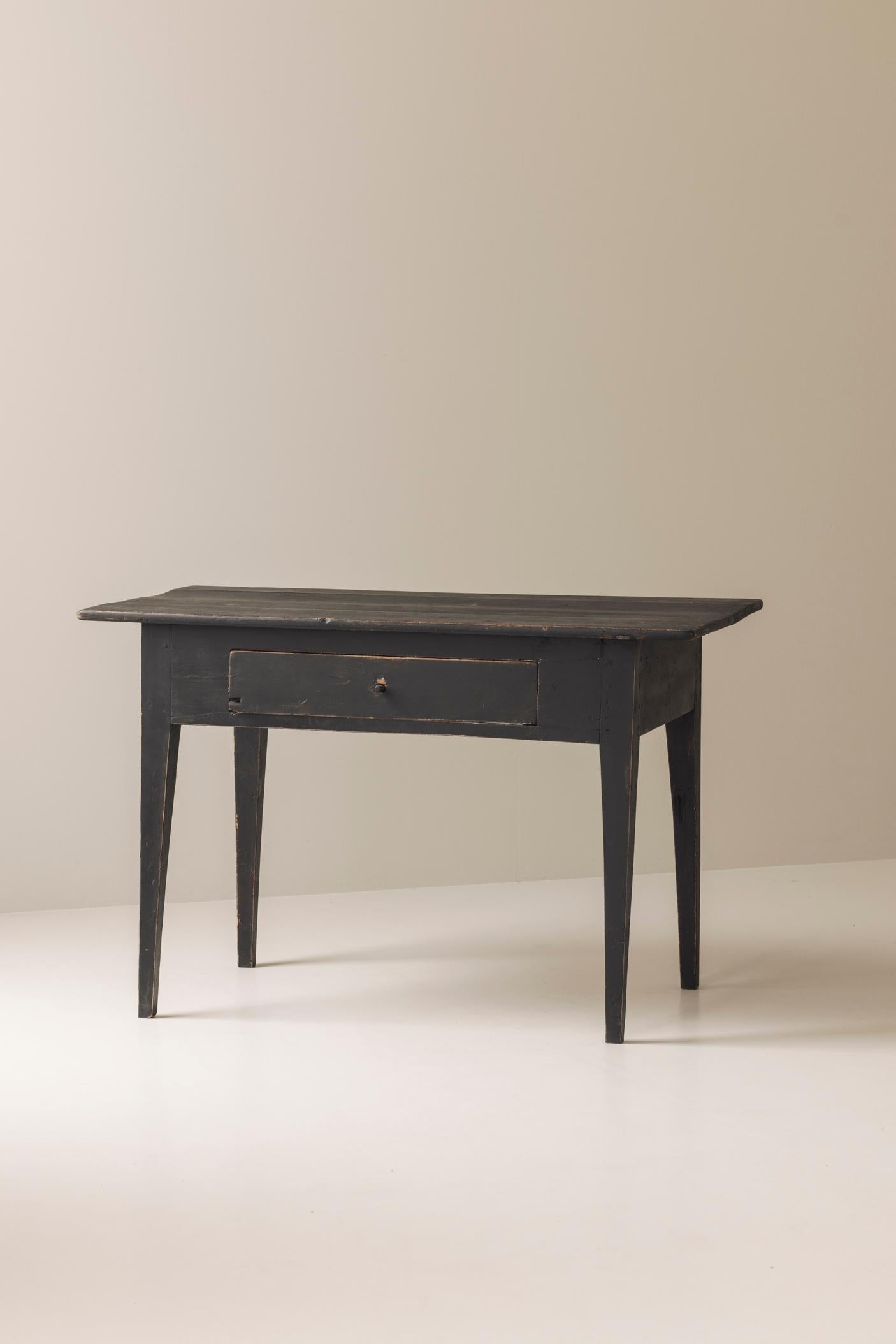A beautiful example of Swedish allmoge craftsmanship from the 19th century, this table carries the authentic charm of rural Scandinavian tradition. Made in pine and painted in a deep, timeworn black, it shows the rich patina of age with subtle wear