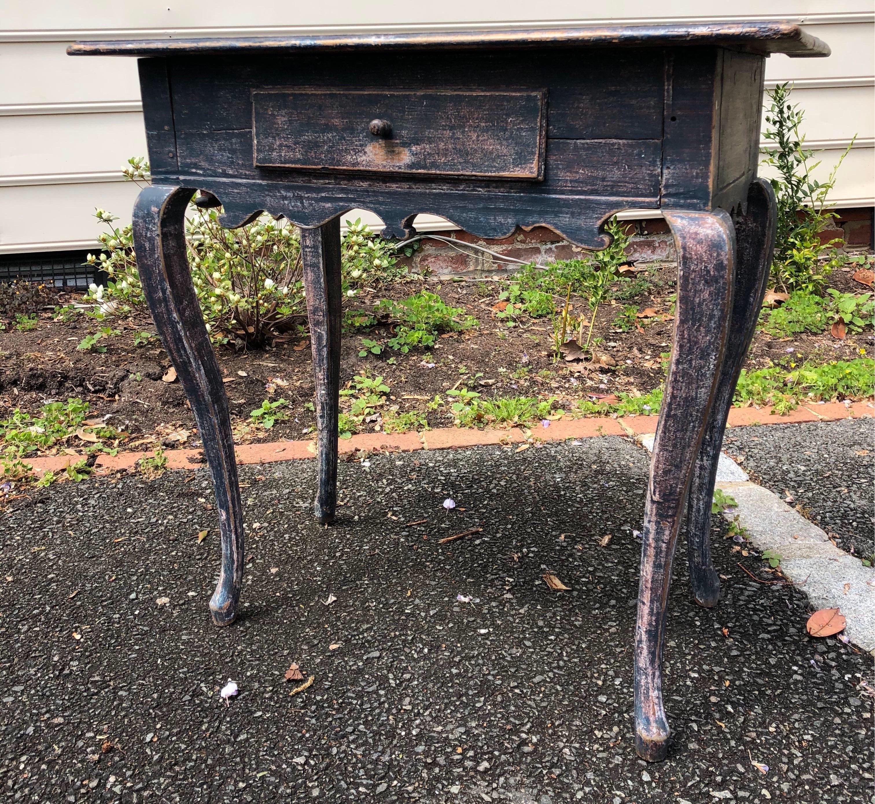 19th century Swedish blue painted side table with single drawer and carved apron.