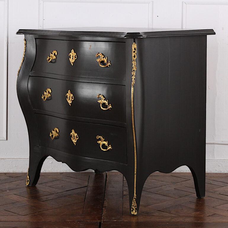 19th century Swedish painted or ebonized ‘bombe’ three-drawer commode with highly-detailed gilt mounts. Nicely-made smaller antique commode with later painted finish.
 
  