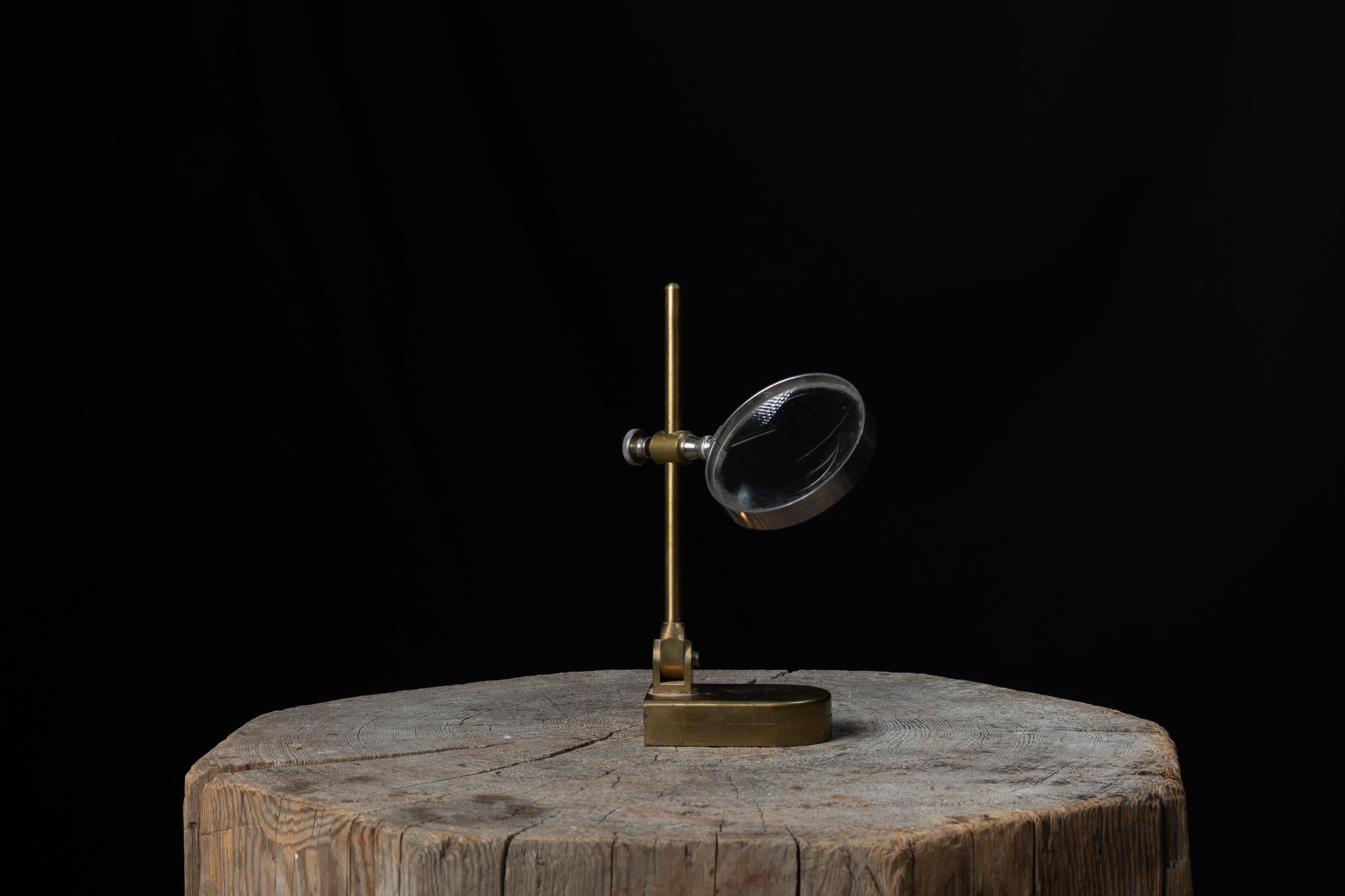 vintage magnifying glass on stand