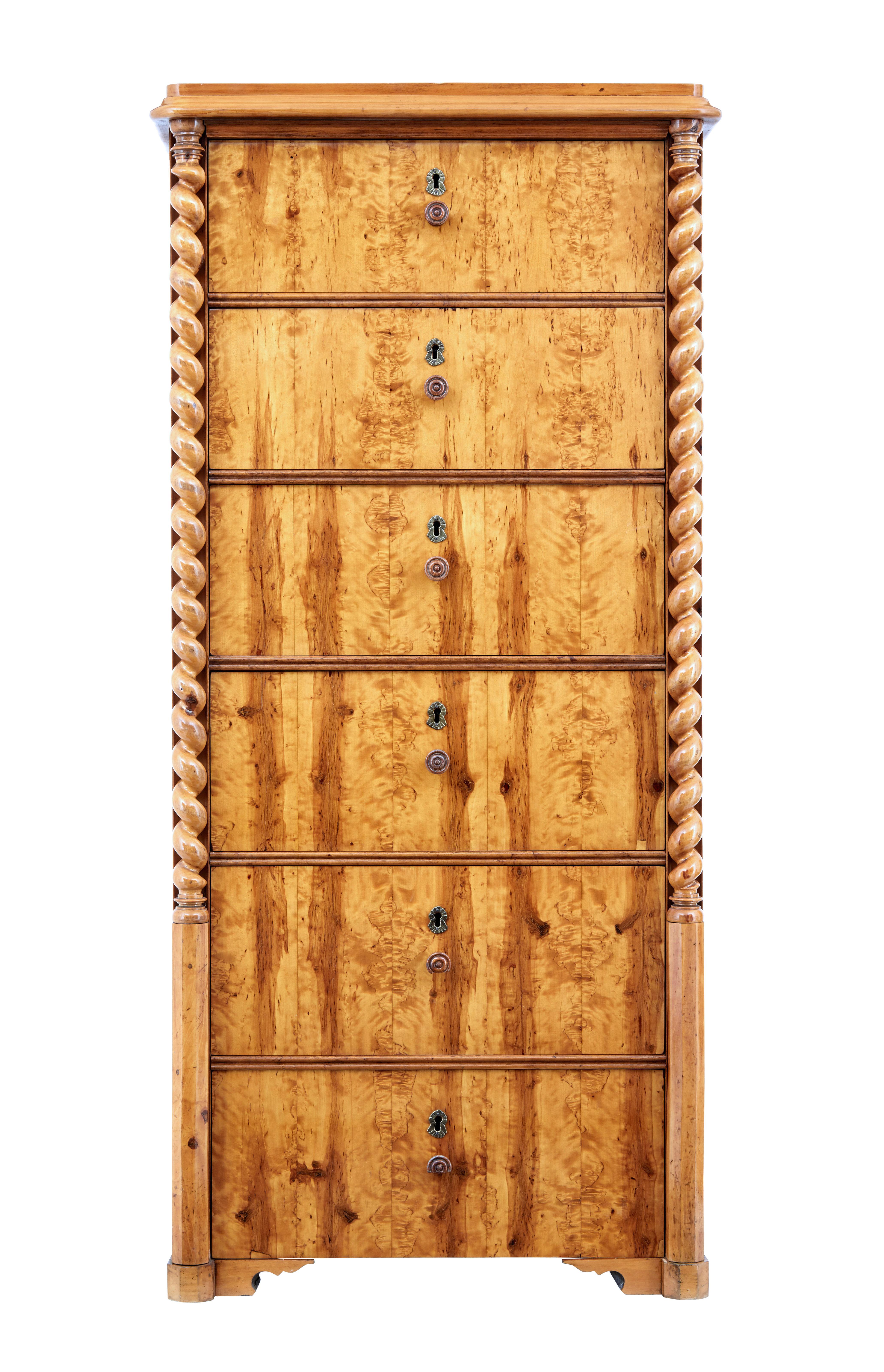 Elegant burr birch tallboy chest of drawers, circa 1870.

6 deep drawers veneered in matched burr birch veneer, each fitted with a single turned wooden handle. Drawers are flanked each side by a barley twist column. Plain birch sides.

Rich