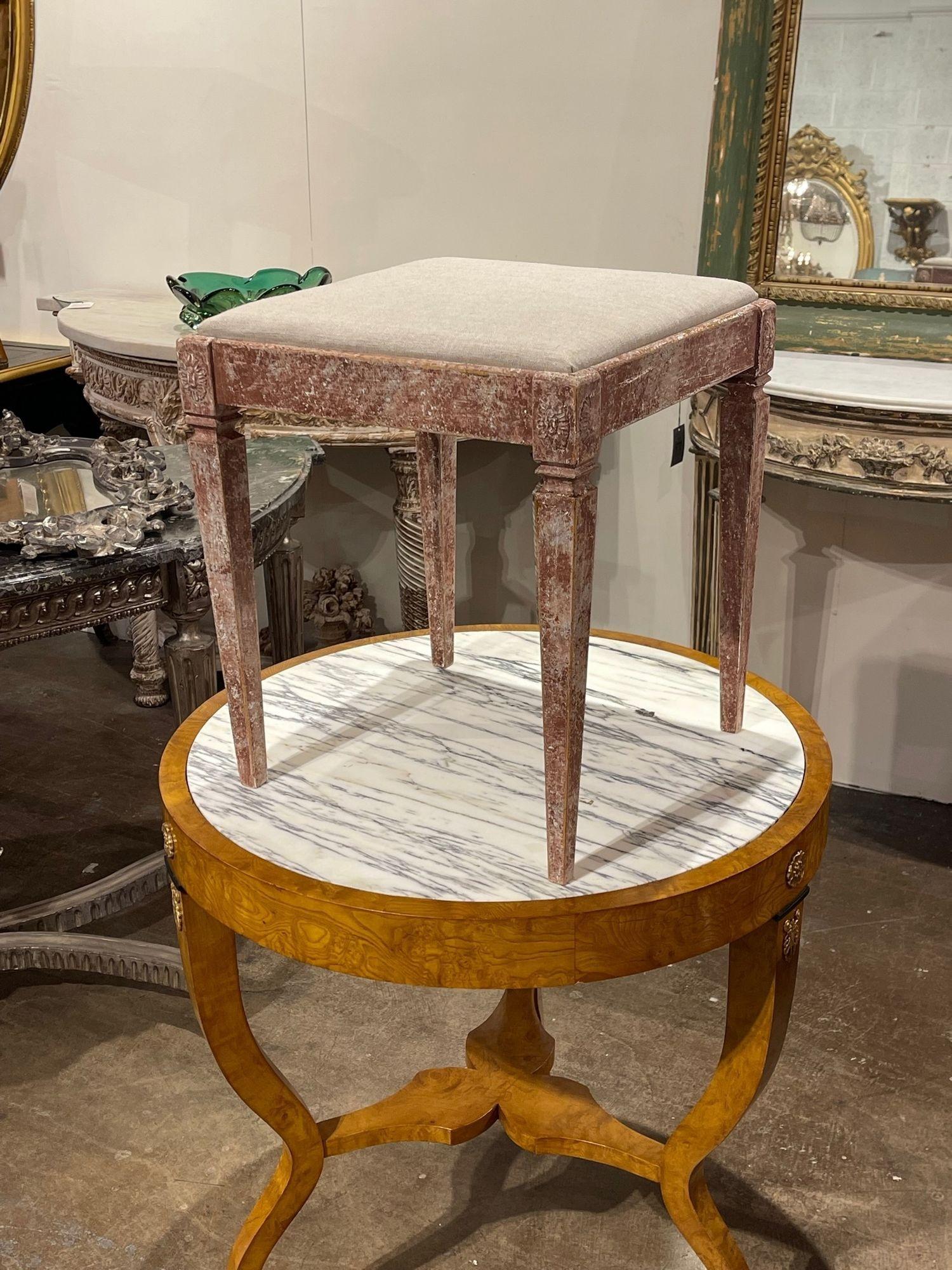 Beautiful 19th century Swedish carved and painted stool. This piece has the original red paint finish. So pretty! A great accent piece!