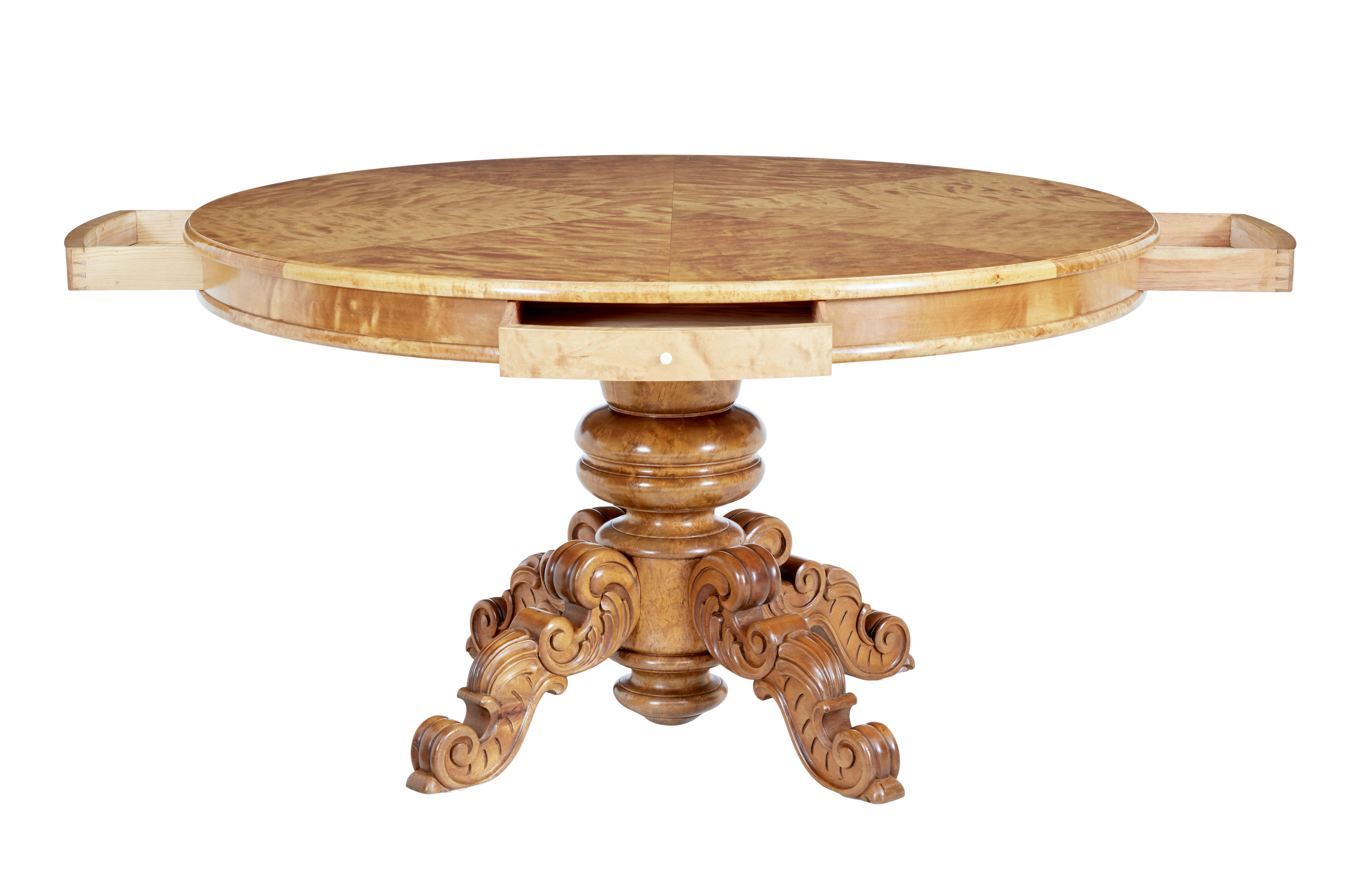 19th century birch Swedish carved drum centre table, circa 1890.

Know as a drum table but this table would function well as a dining table.

Large circular center table, with 4 shallow drawers placed at equal positions around the edge. Top