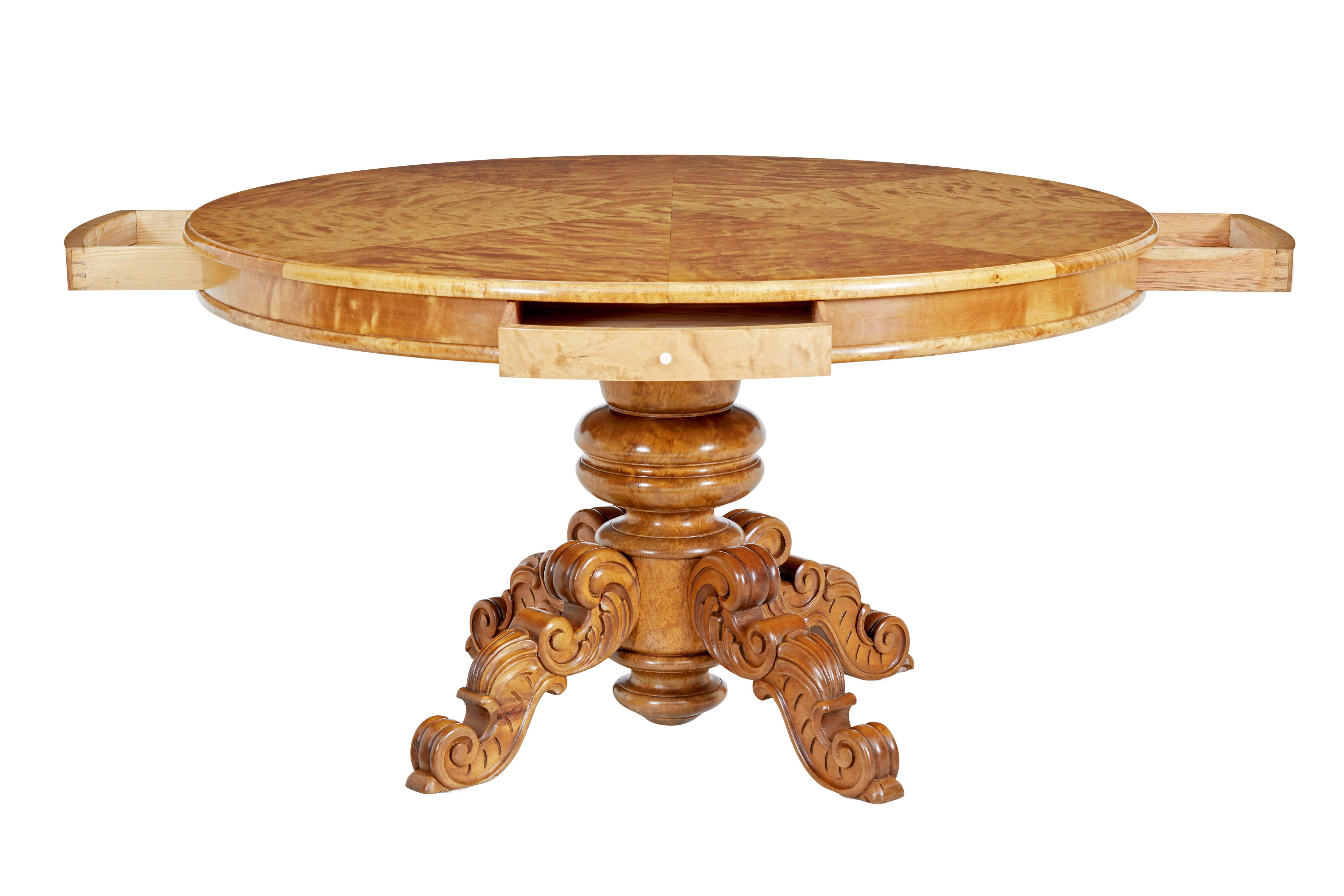 19th century birch Swedish carved drum centre table, circa 1890.

Know as a drum table but this table would function well as a dining table.

Large circular center table, with 4 shallow drawers placed at equal positions around the edge. Top arranged