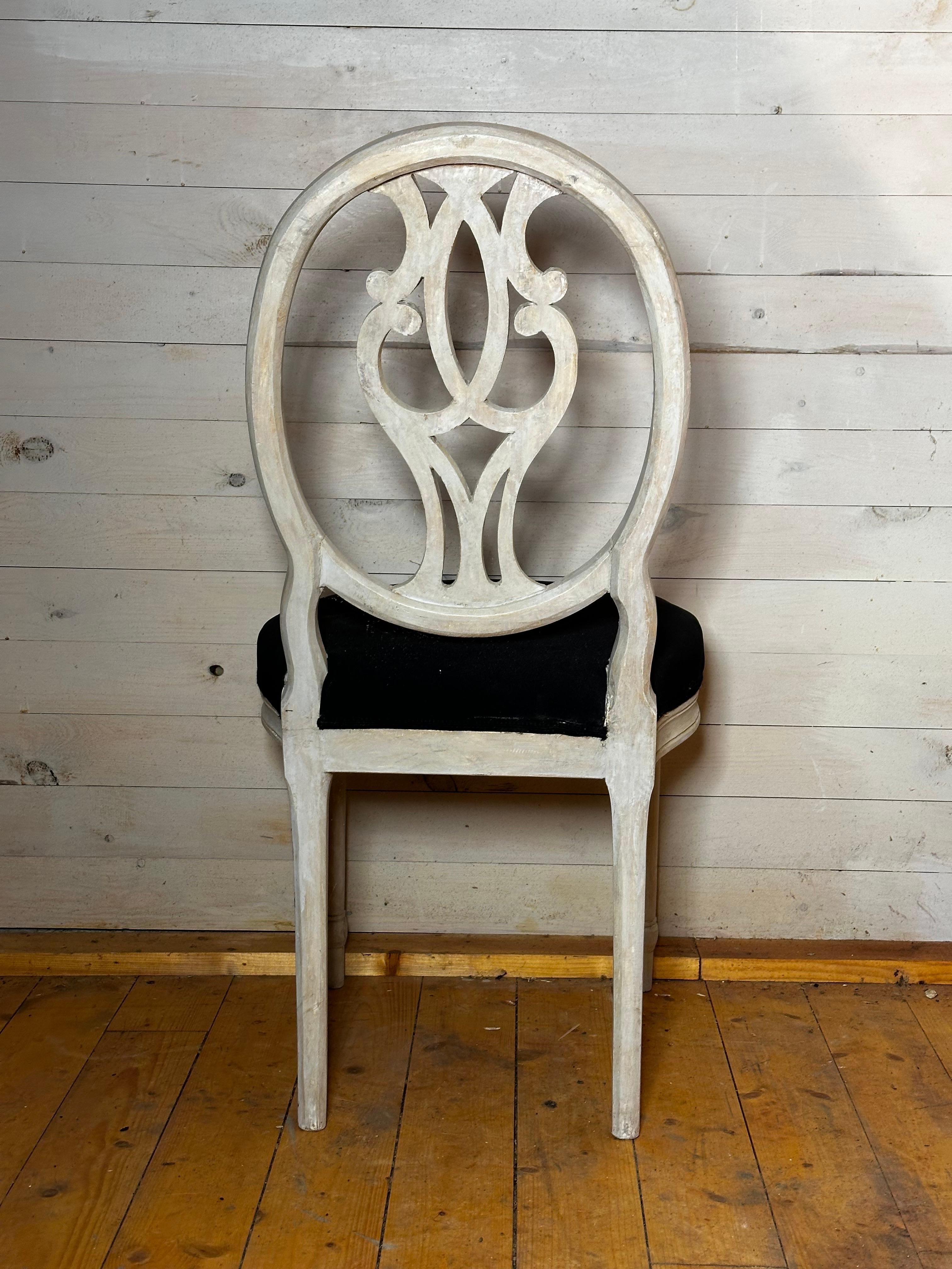 A pair of Swedish chairs about 1840:s. The back is very unusual and could be seen as a double G, referring to King Gustav the Third in Sweden.
There are two pairs.
