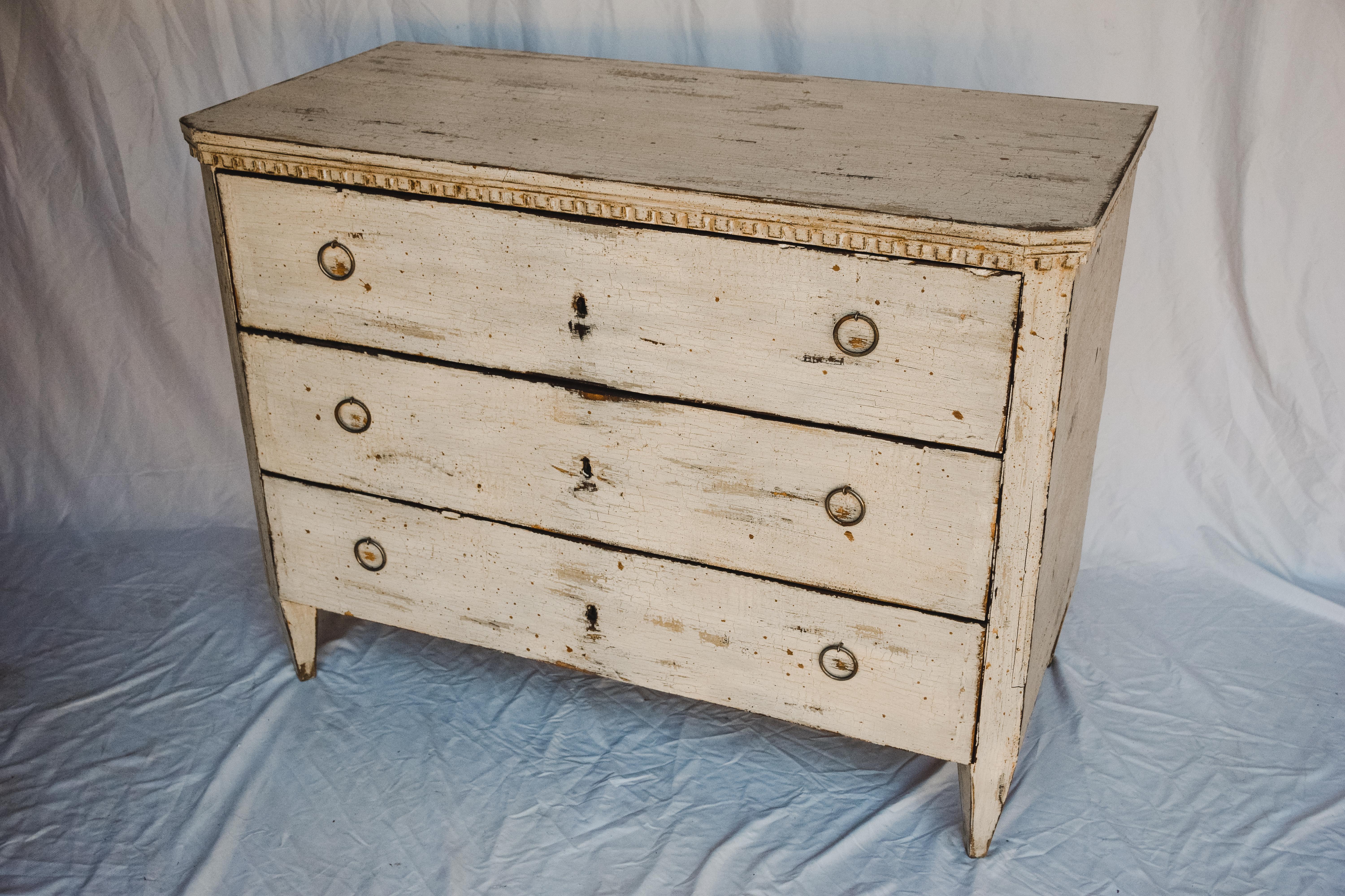 The commode features three nice sized drawers with sufficient storage. Solid wood painted in a soft white, brass handles and keyholes.

This piece is a wonderful storage solution with a timeless decorative style bringing a touch of elegance and