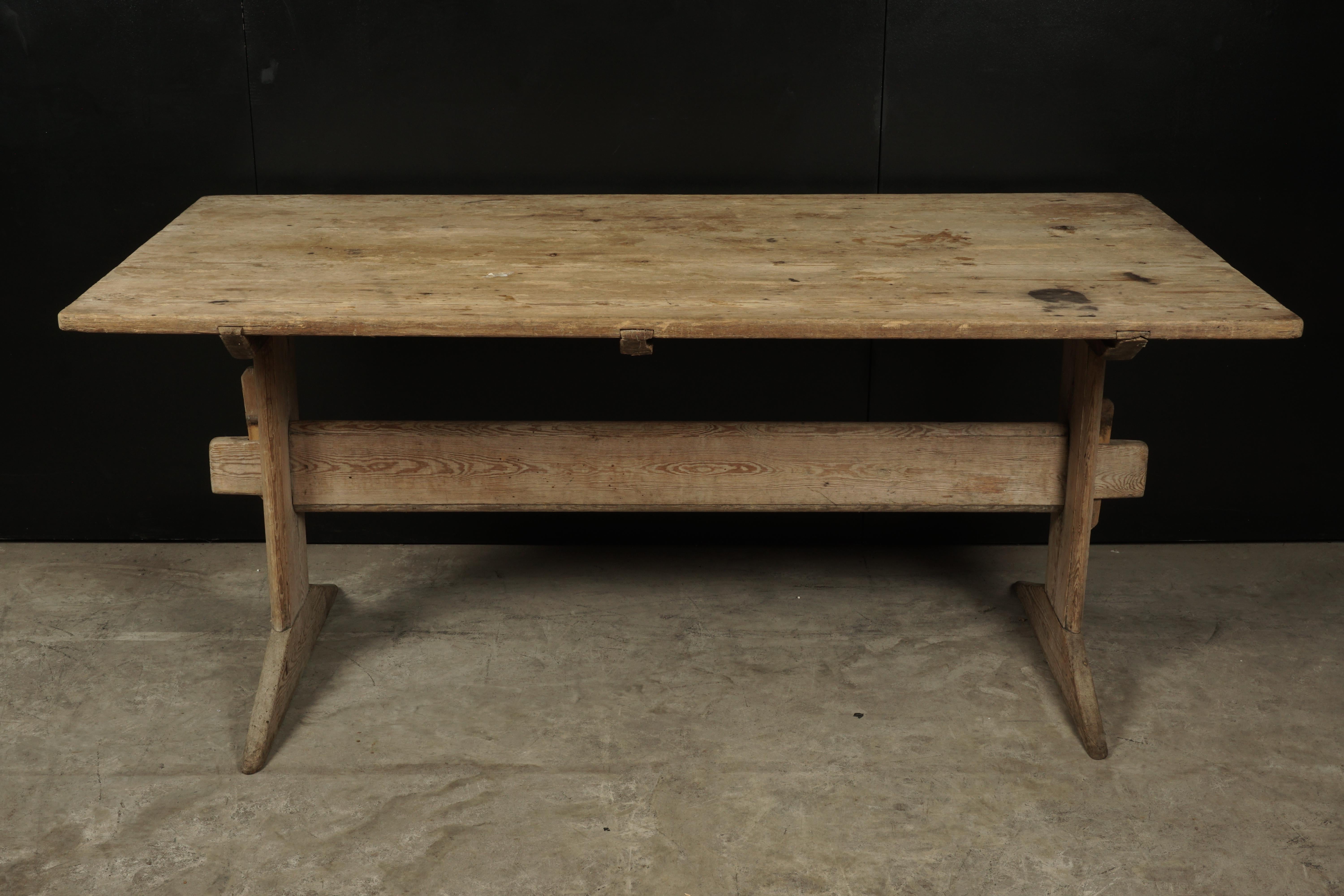 19th century Swedish dining table in pine, circa 1850. Fantastic patina and wear.
