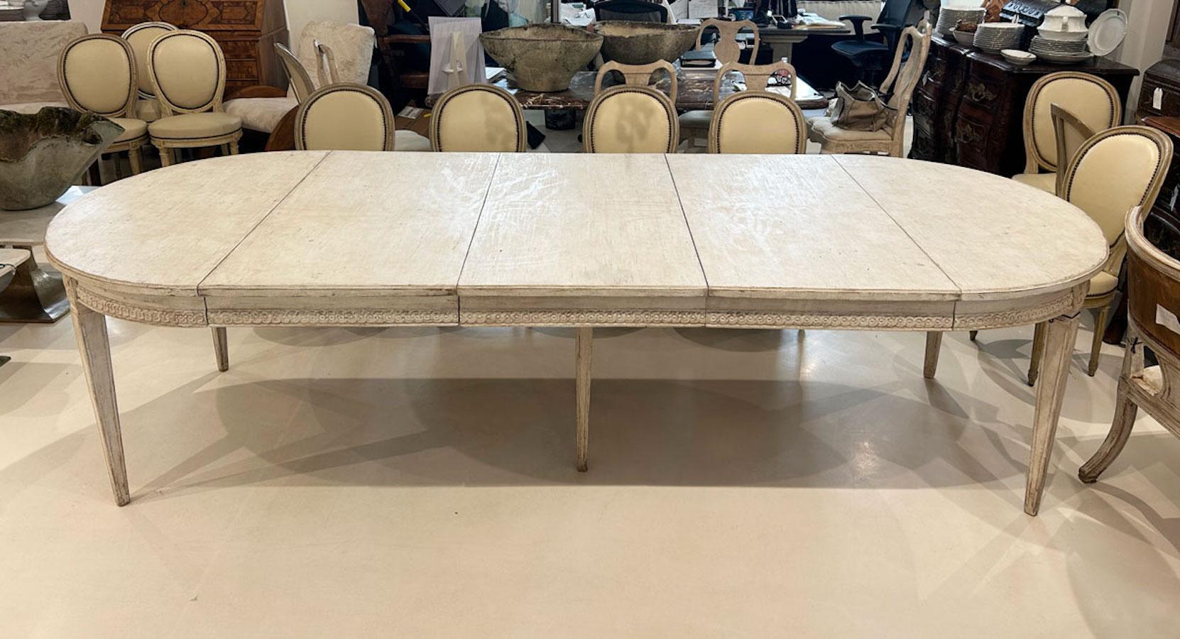 This elegant 19th Century Swedish dining table is a fine example of Gustavian design, known for its simplicity, elegance, and timeless appeal. The table features a beautifully aged patina that highlights the natural beauty of the wood, giving it a