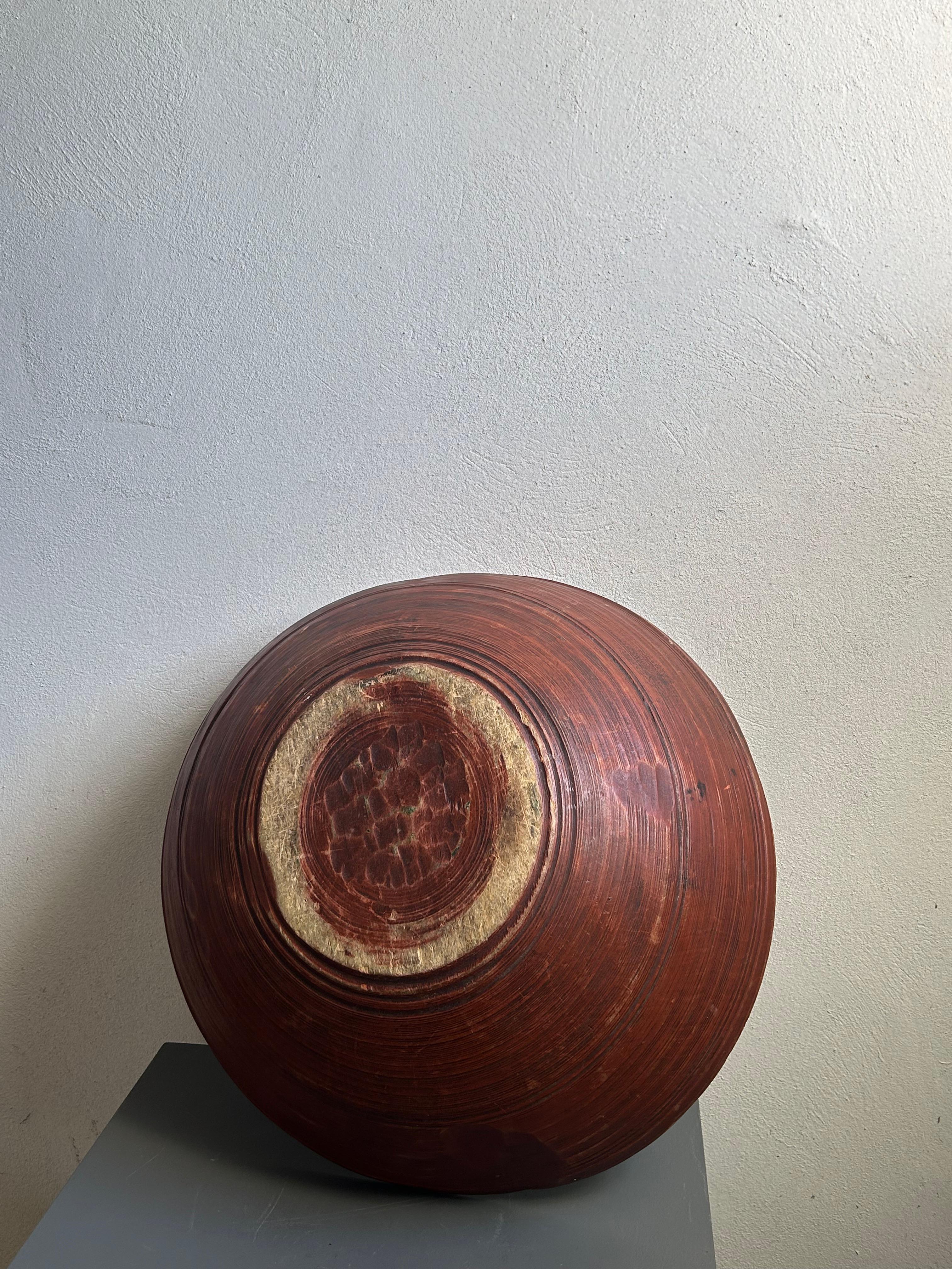 This rare 19th-century Swedish allmoge dough bowl (dejtrug) is a remarkable example of traditional Scandinavian rural craftsmanship. Hand-carved from a single piece of wood, it retains its original deep red paint—a color commonly used in Swedish