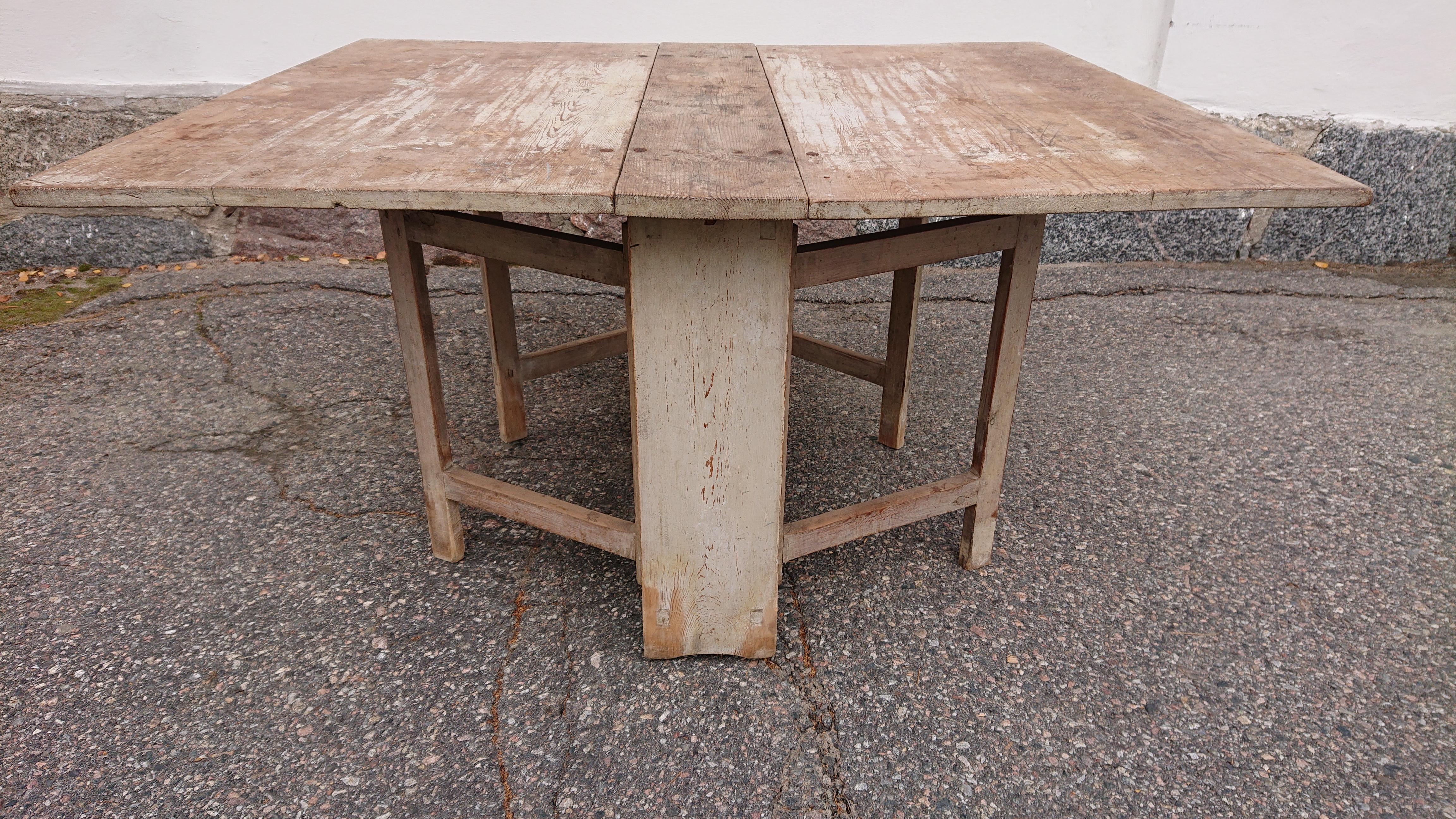 19th Century drop leaf table from Skelleftea ,Northern Sweden.

Measurements H. 75cm W. 145cm D. 123cm
The measurements shown in the listing is when the drop- leaves are folded down for an accurate shipping quote.

The table has leaf on each