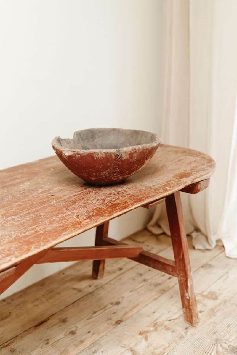 A lovely dugout Swedish bowl, with rests of old red paint. Dated 1821.