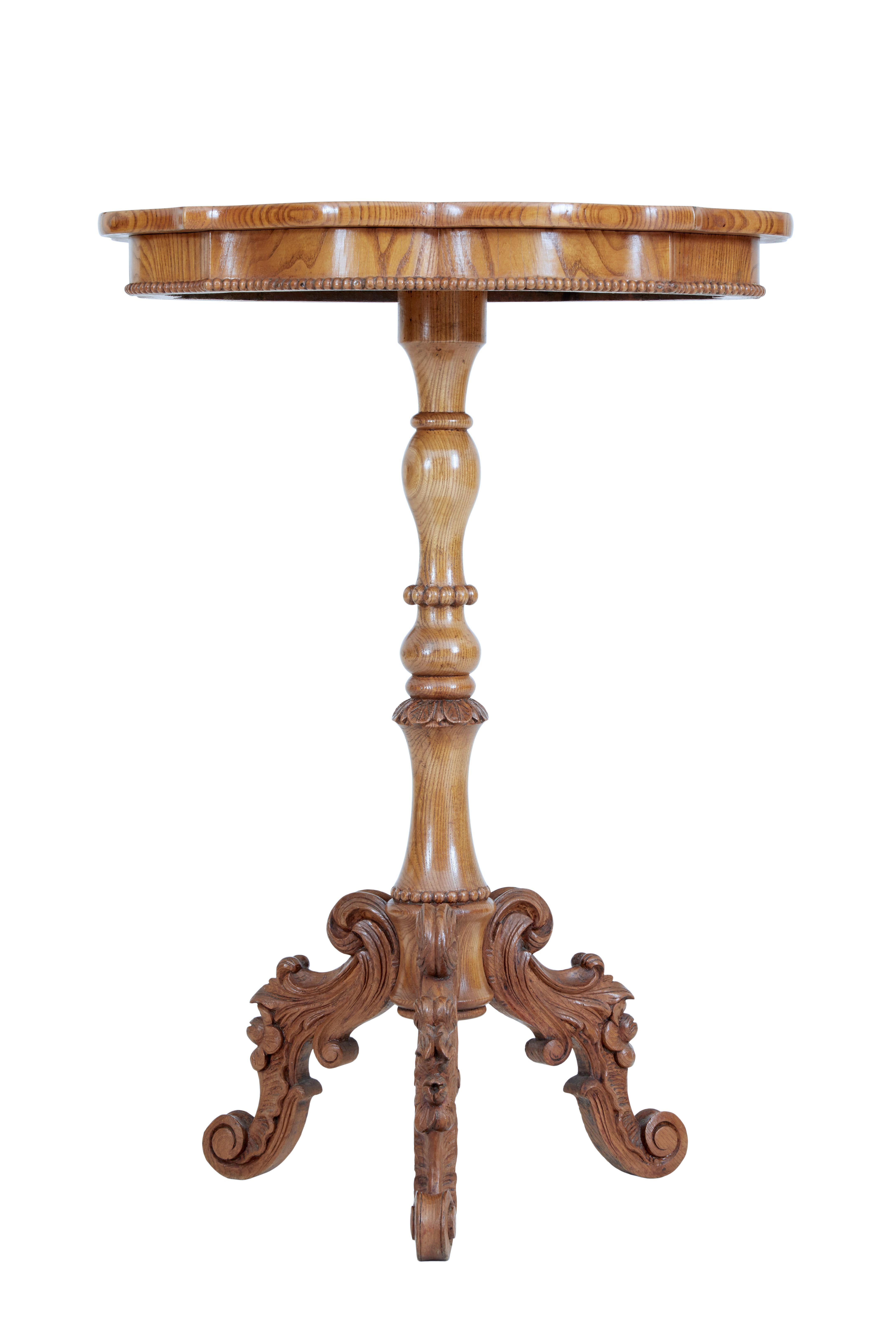 19th century Swedish elm shaped occasional table, circa 1870.

Good quality shaped top occasional table. Top veneered in matched elm and detailed with beaded edge below the frieze. Standing on a turned a carved stem, with 3 carved scrolled