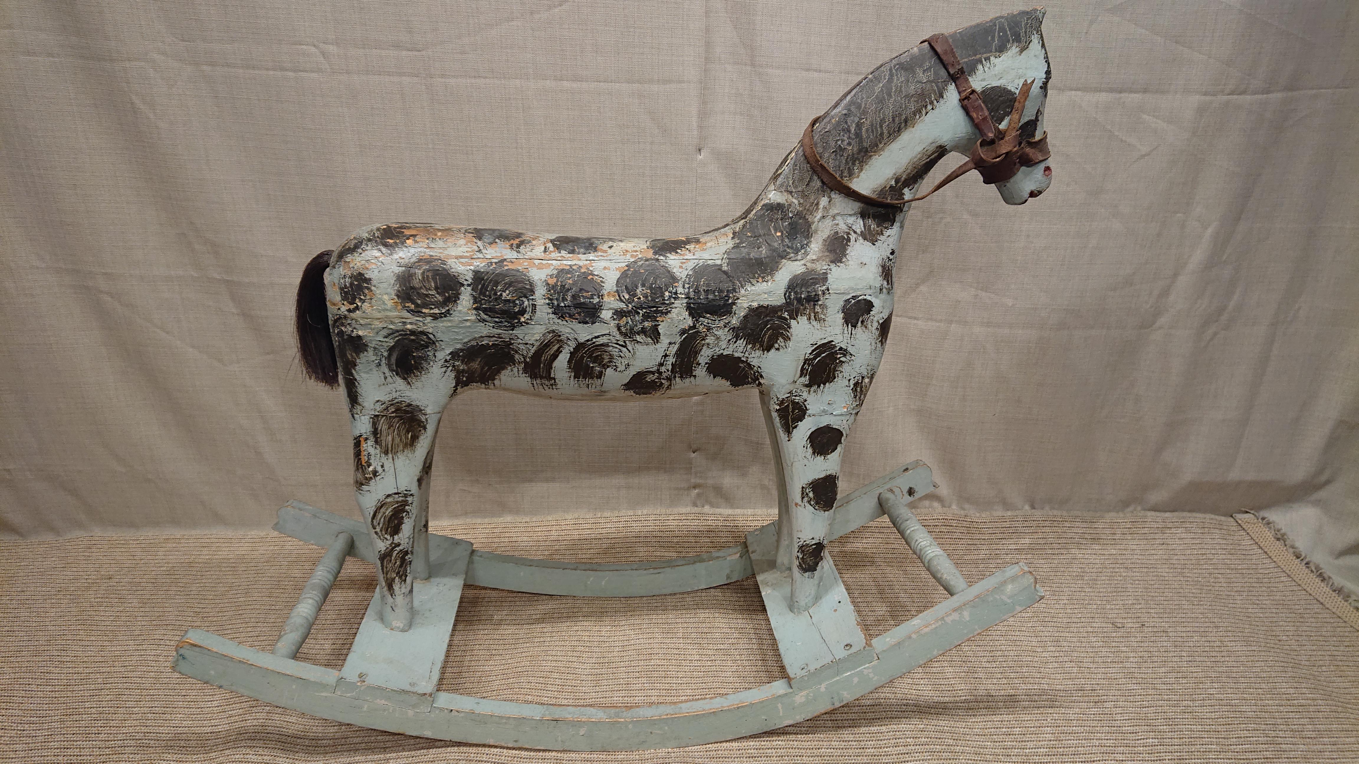 19th Century Swedish rocking horse from Skelleftea Vasterbotten, Northern Sweden .
A very charming horse with beautiful color & dotted pattern.
Beautiful unusual untouched Original Paint.
Color crackles occur.
The mane is painted and the tail is