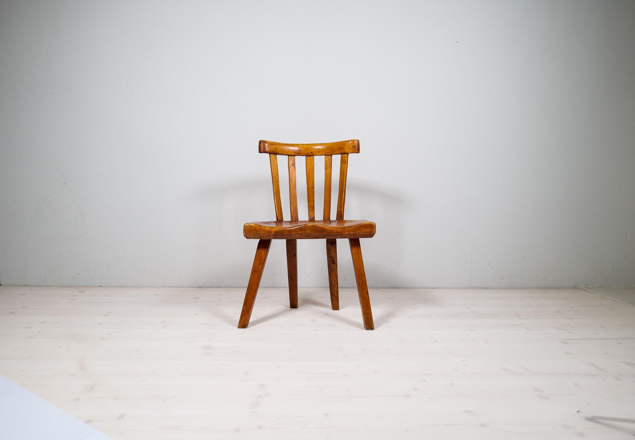Folk art made in Sweden at its best. This chair with highly appealing shapes and patina. Made in the late 19th century this chair is a given piece to any modern home that wants to have something out of the ordinary. Caved seat and the top of the
