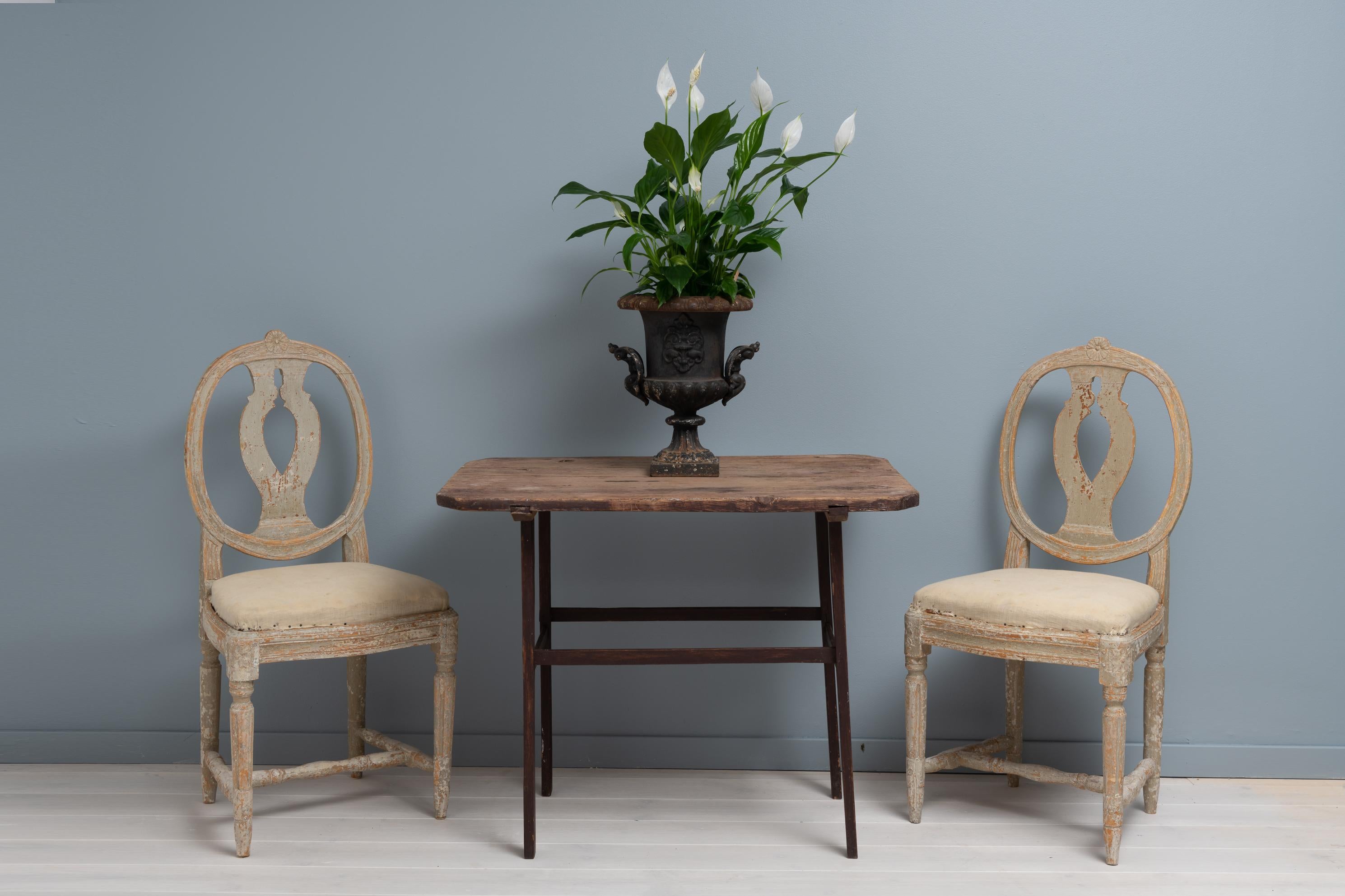 Rare folk art table from Sweden, dated underneath to 1819. The table is pine and has the warm patina of aged wood. Marked with the owners house mark which was a way to show ownership at the time. The condition is original and completely untouched