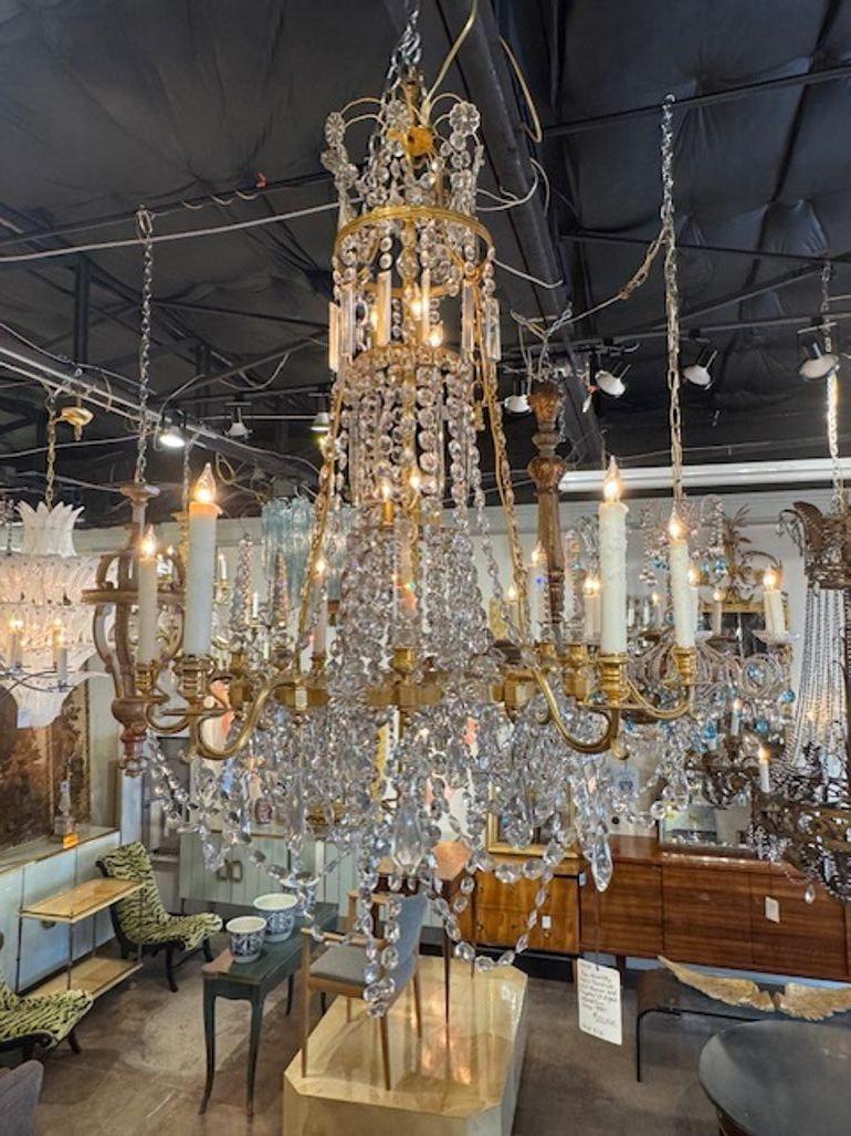 The 19th Century Swedish Gilt Bronze and Crystal Chandelier embodies the elegance and luxury of the period. This exquisite chandelier features beautiful, polished bronze, and sparkling crystals that add a touch of glamour to any room. Perfect for