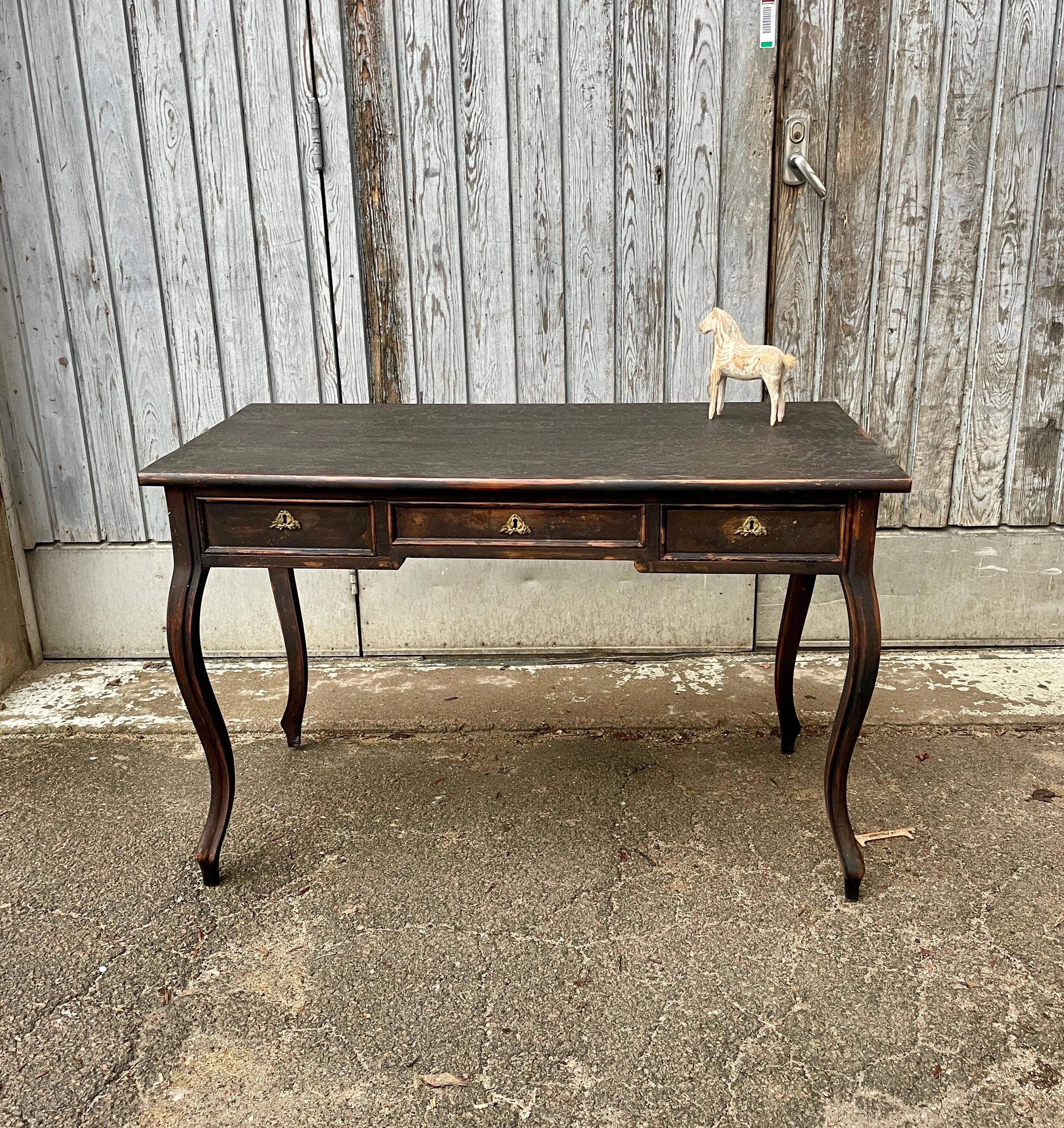Black Painted Gustavian 3-Drawer Office Desk, Sweden 

Classic and simple Scandinavian style writing desk with cabriole legs in its original finish. This desk has been hand carved and hand painted. The drawer hardware is brass. Wonderful piece for