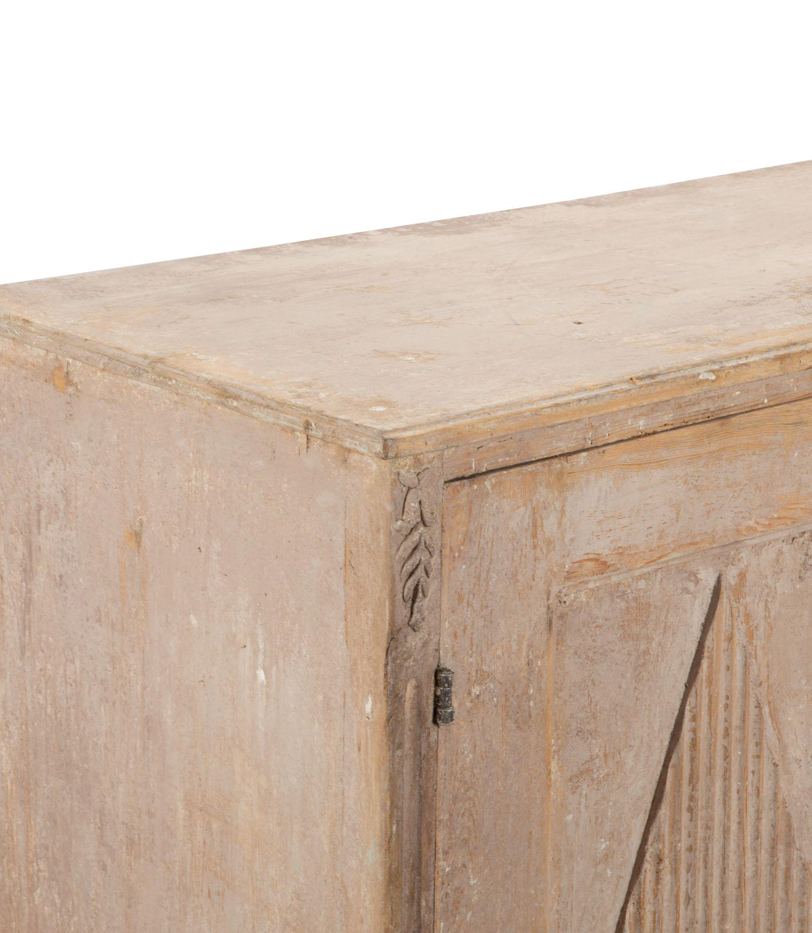 19th Century Swedish Gustavian buffet.
A well carved piece with decorative reeded diamond detail to the doors, opening to useful storage.
Re-painted with later key locks.
Circa 1860.