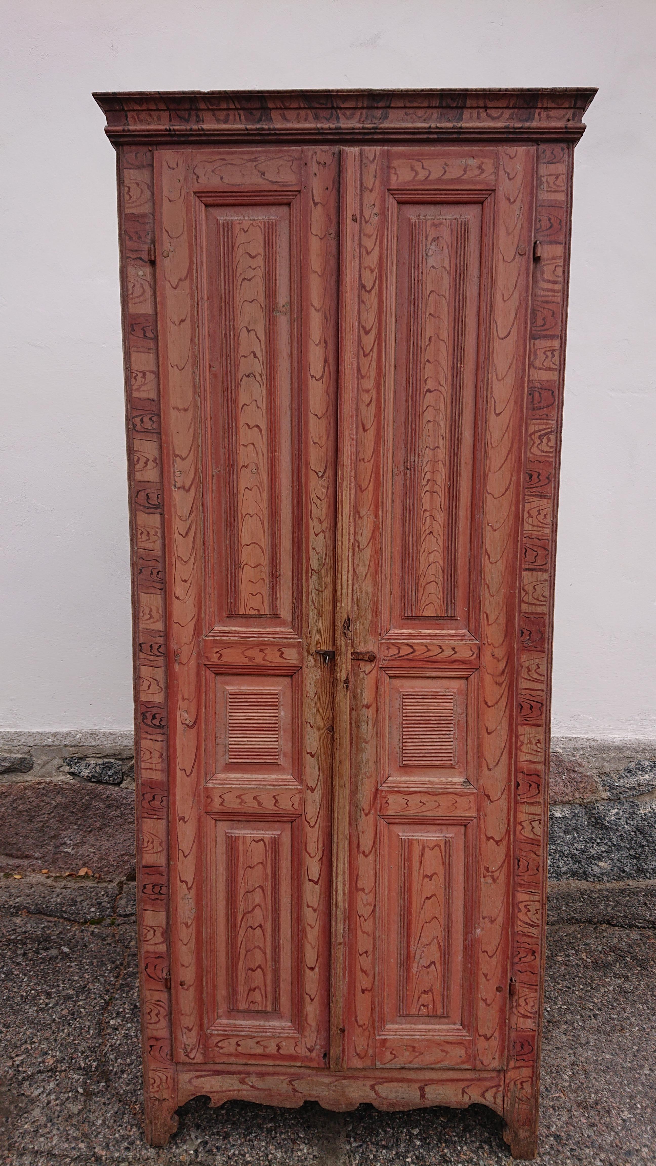 19th century Gustavian Cabinet from Ranea Norrbotten, Northern Sweden.
Av stunning Gustavian cabinet with untouched original paint dated 1835.
A fantastically beautiful painting in beautiful colors.
Fine shape & size.Fits well in any home.
Its