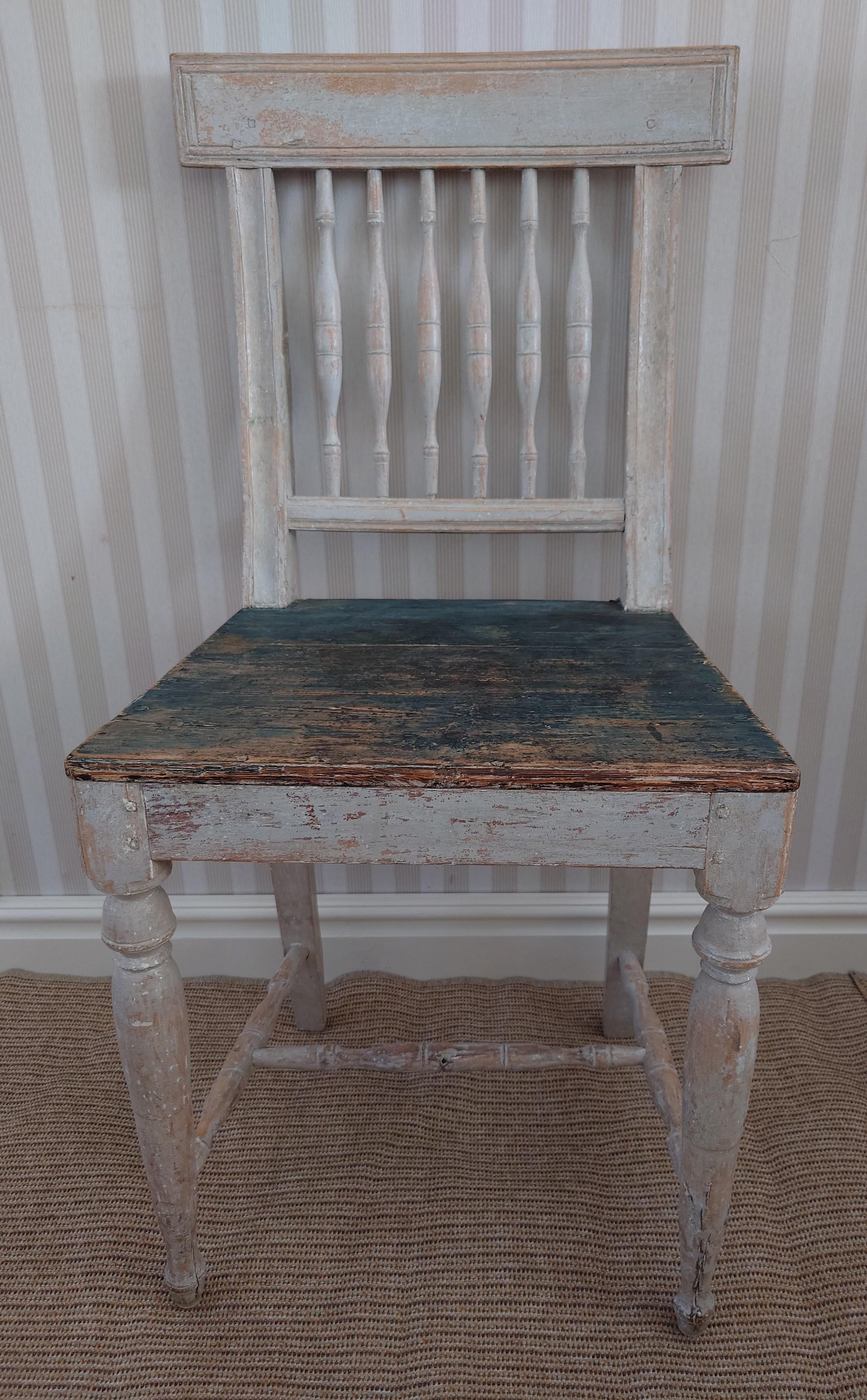 19th century Swedish Gustavian chair from Burträsk Västerbotten, Northern Sweden. The chair is scraped by hand to its well-preserved original painting.
Beautifully carved pilasters in the back of the chair.
The chair is very genuine and has a