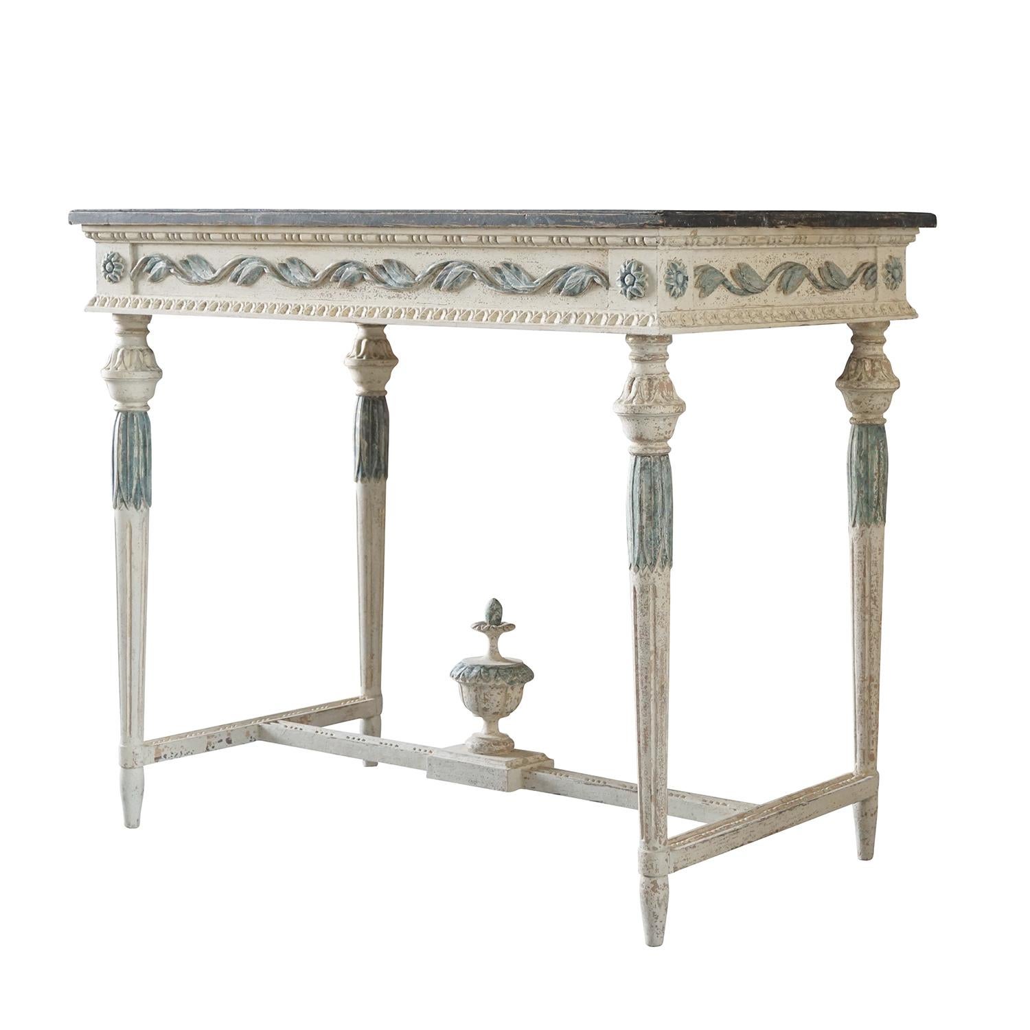 An antique Swedish Gustavian freestanding console table made of pinewood, scraped down to his original hardware and original grey, dark blue color faux marble hand painted. The Scandinavian hand carved console table is in good condition, detailed in