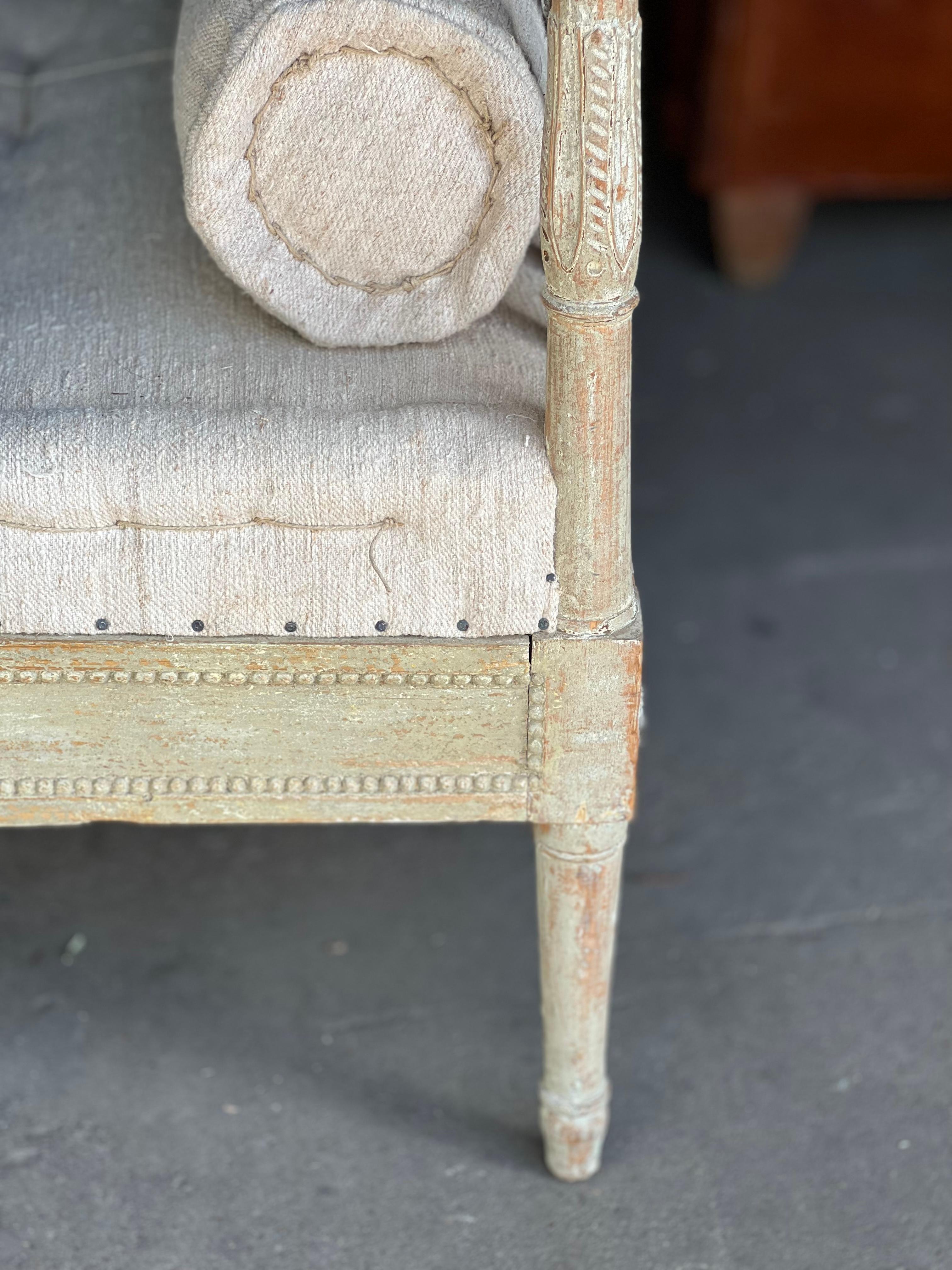 Beautiful 19th century Gustavian Daybed. Dryscrapped and has been carefully reupholstered with a primitive Belgian linen. It comes with back wooden slats and custom cushions to convert into a sofa if one chooses too which shows how it can be put