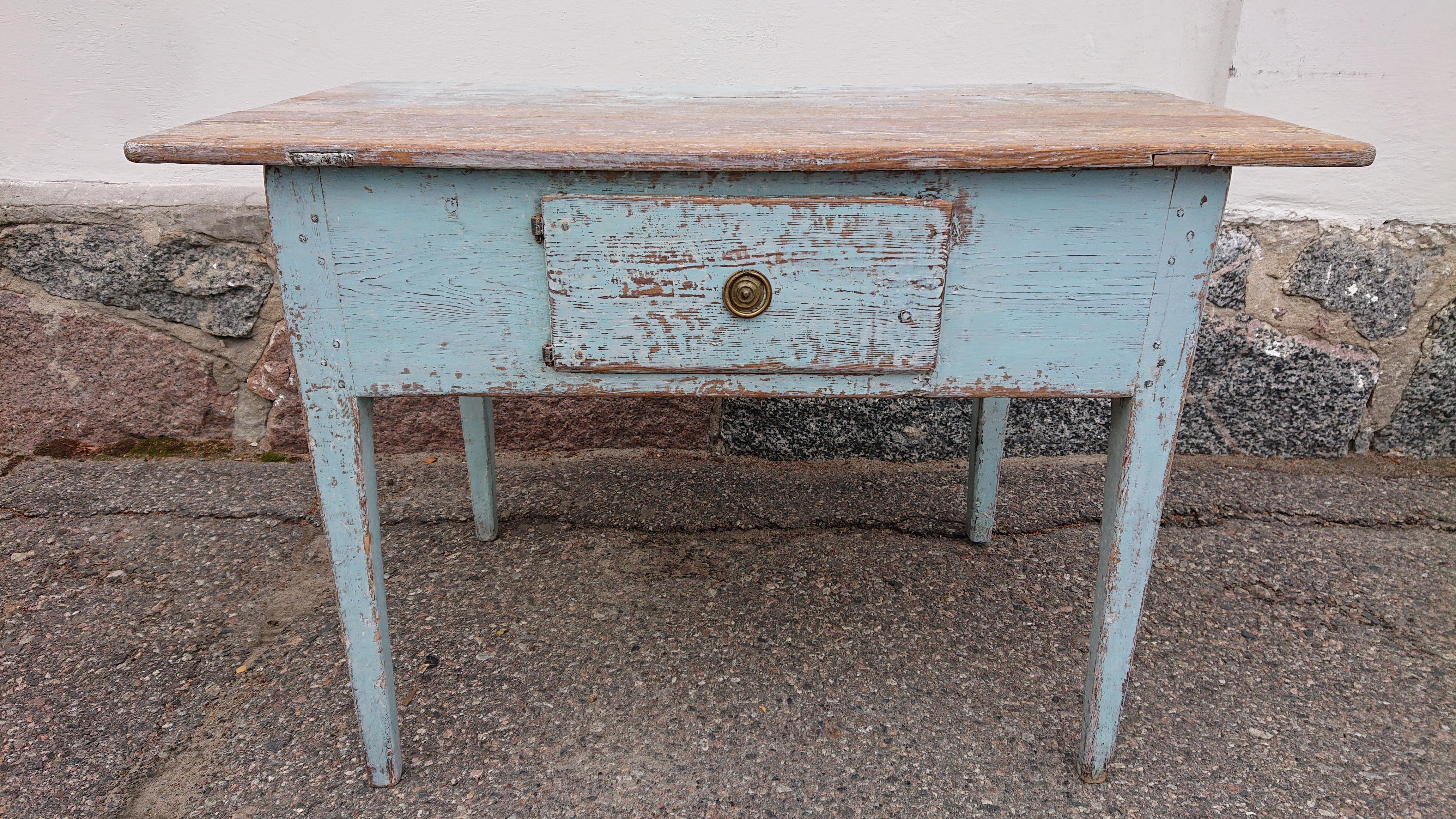 Unusual charming early 19th Centurty Swedish Gustavian desk with a door instead of a drawer.
Nice patina on the desk. 
The desk is scraped by hand to its originalpaint in a lovely blue color.
Original hinges on the door and original
