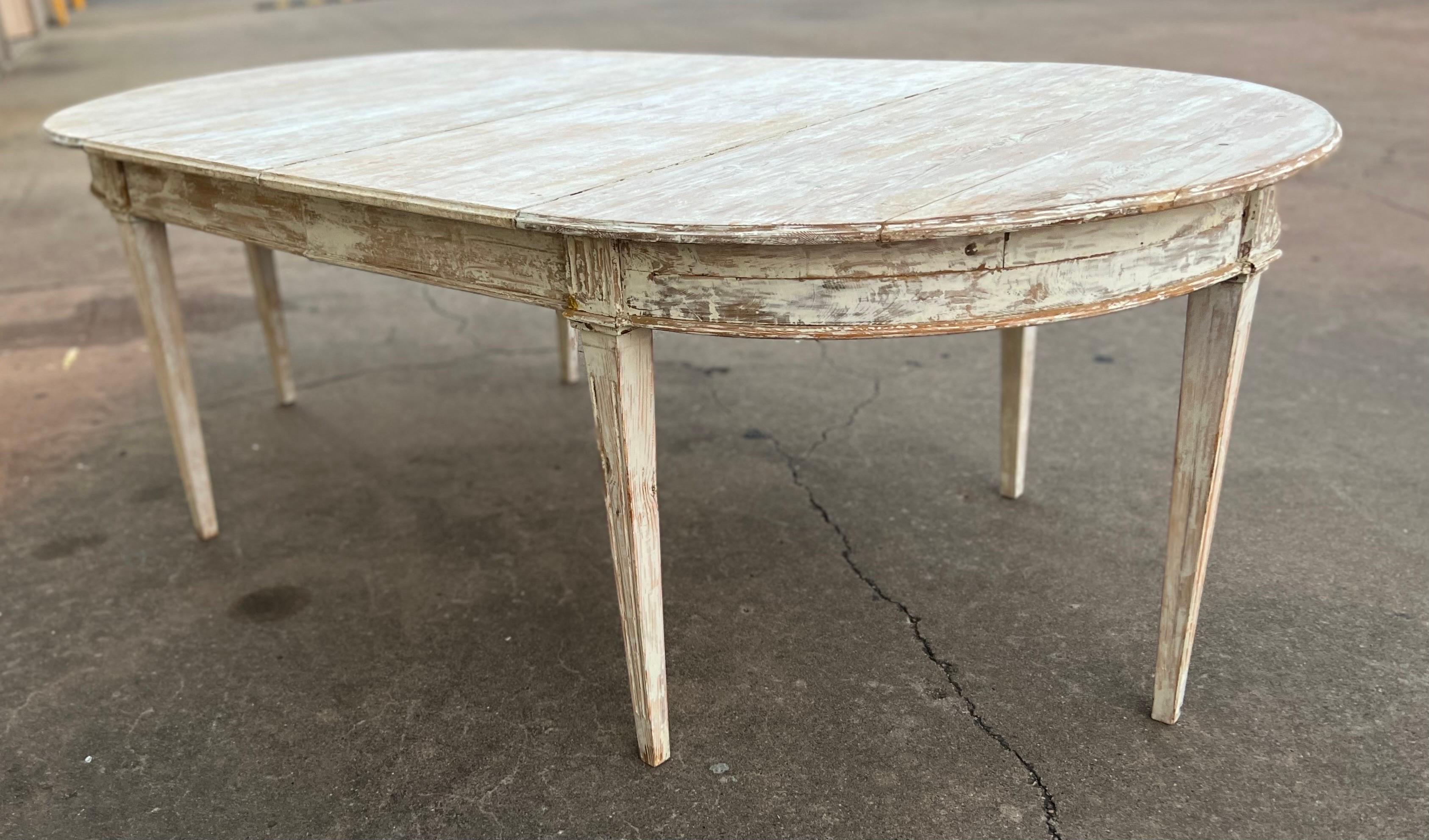 Stunning Swedish dining table that features two removable leaves. The leaves can be removed and the two ends come together as a small round table. Perfect for any area. Seats 6 to 8 comfortably. 

Dims when fully extended: 87.75w x 46.5d x