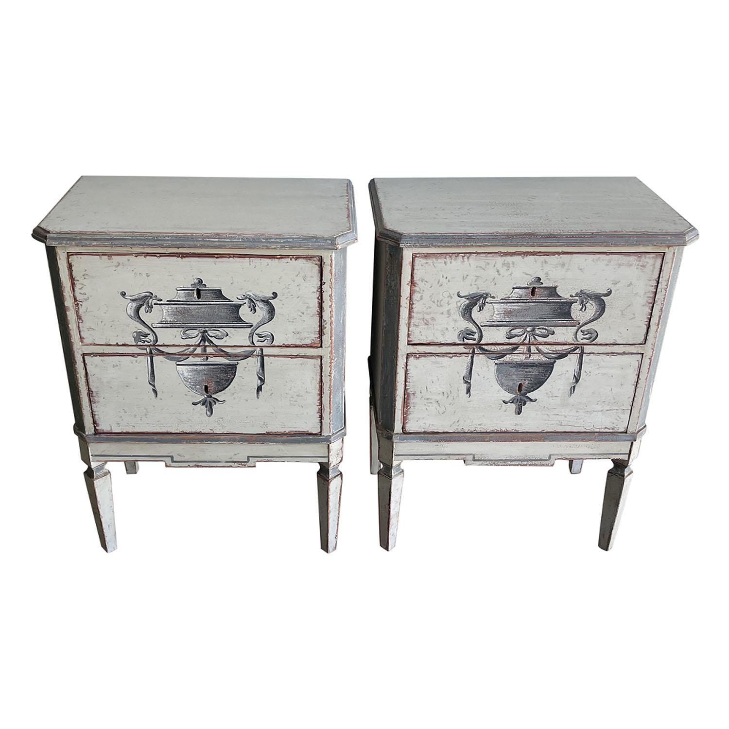 A late 19th Century, antique Swedish Gustavian pair of bed side tables made of hand crafted painted Pinewood, in good condition. Each of the detailed Scandinavian nightstands are composed with two drawers, consisting their original hardware and