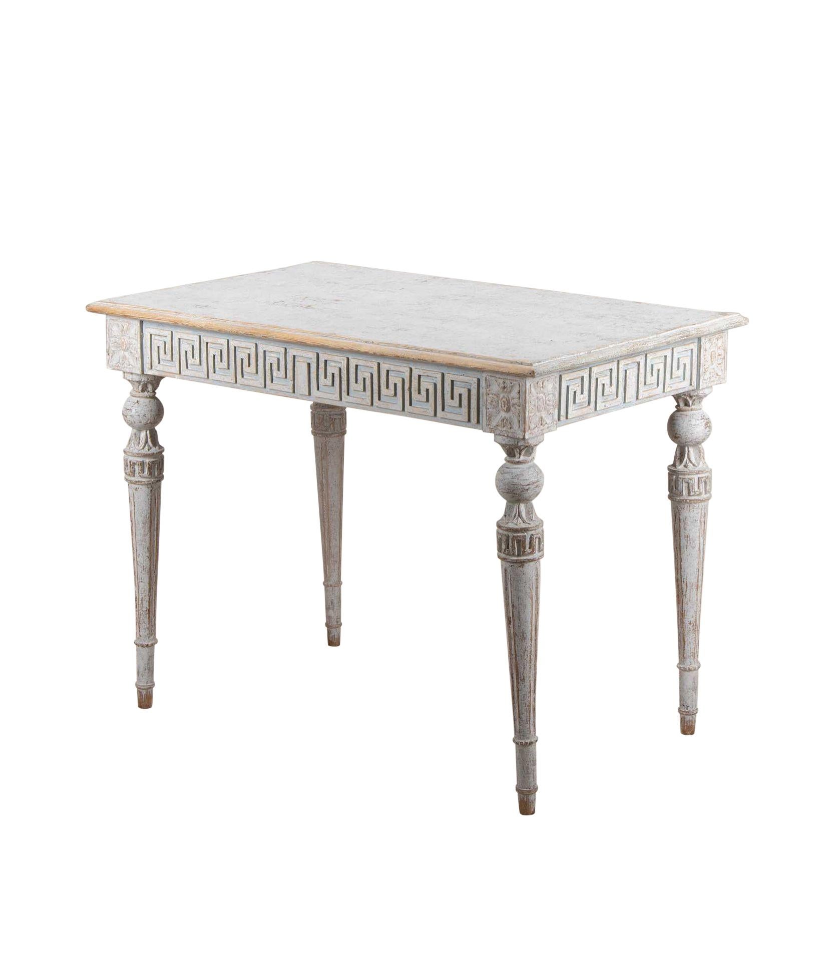 19th Century Swedish Gustavian style console table.
Decorative carved Greek key design all around and on the top of the legs. Re-painted in soft grey.
Circa 1860.