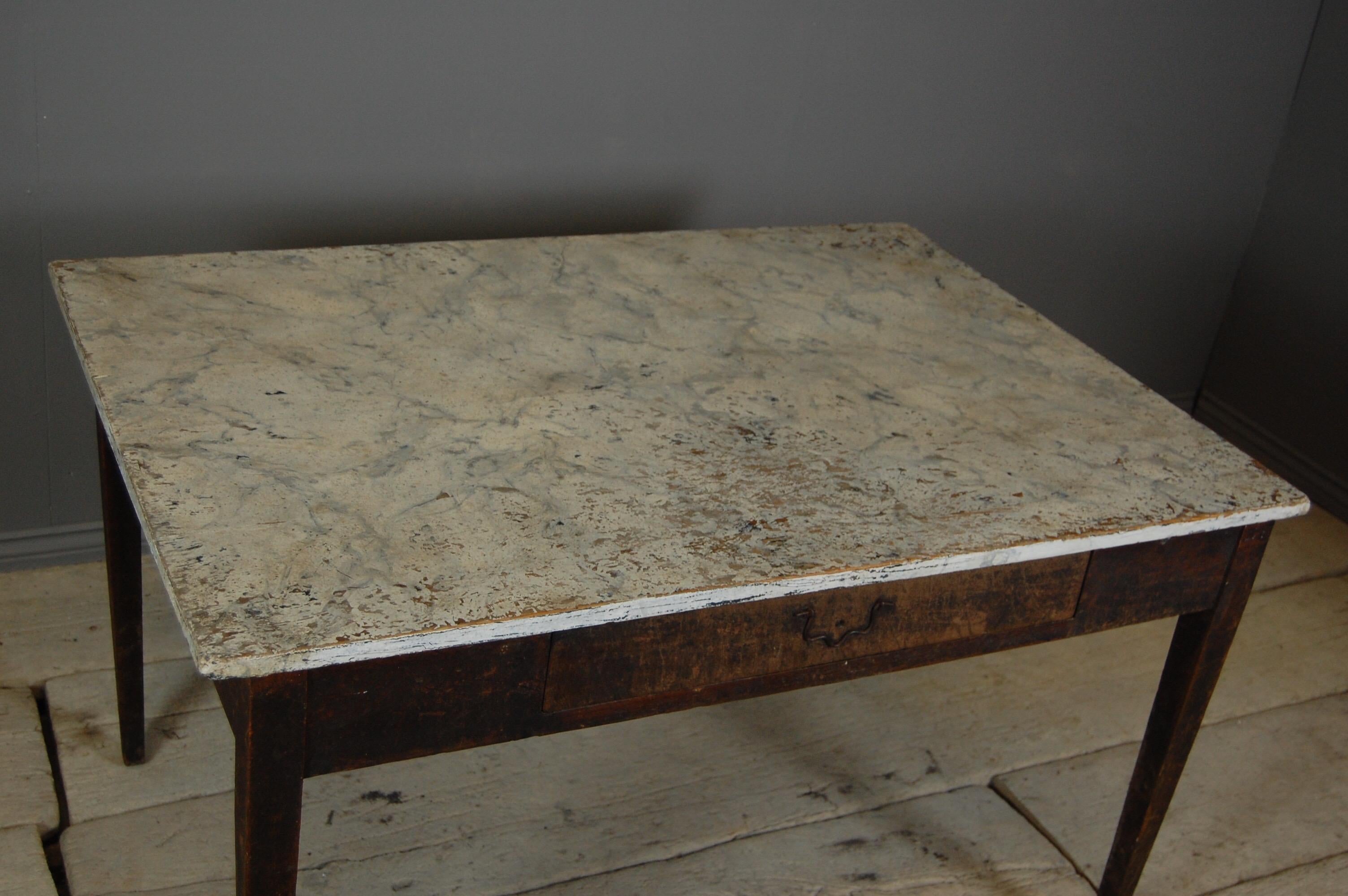 19th century Swedish vernacular Gustavian style writing desk, painted faux marble top with lots of wear.
Dimensions: 120cm x 72cm x 83cm.