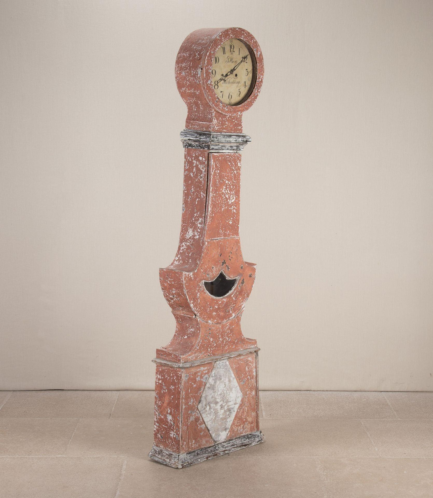 Decorative 19th Century Swedish faded cherry red, unusual model, Mora clock.With later paint. Signs of wear commensurate with age, the clock is for decorative purposes only. Please Note: The clocks we sell are decorative and are not guaranteed to be